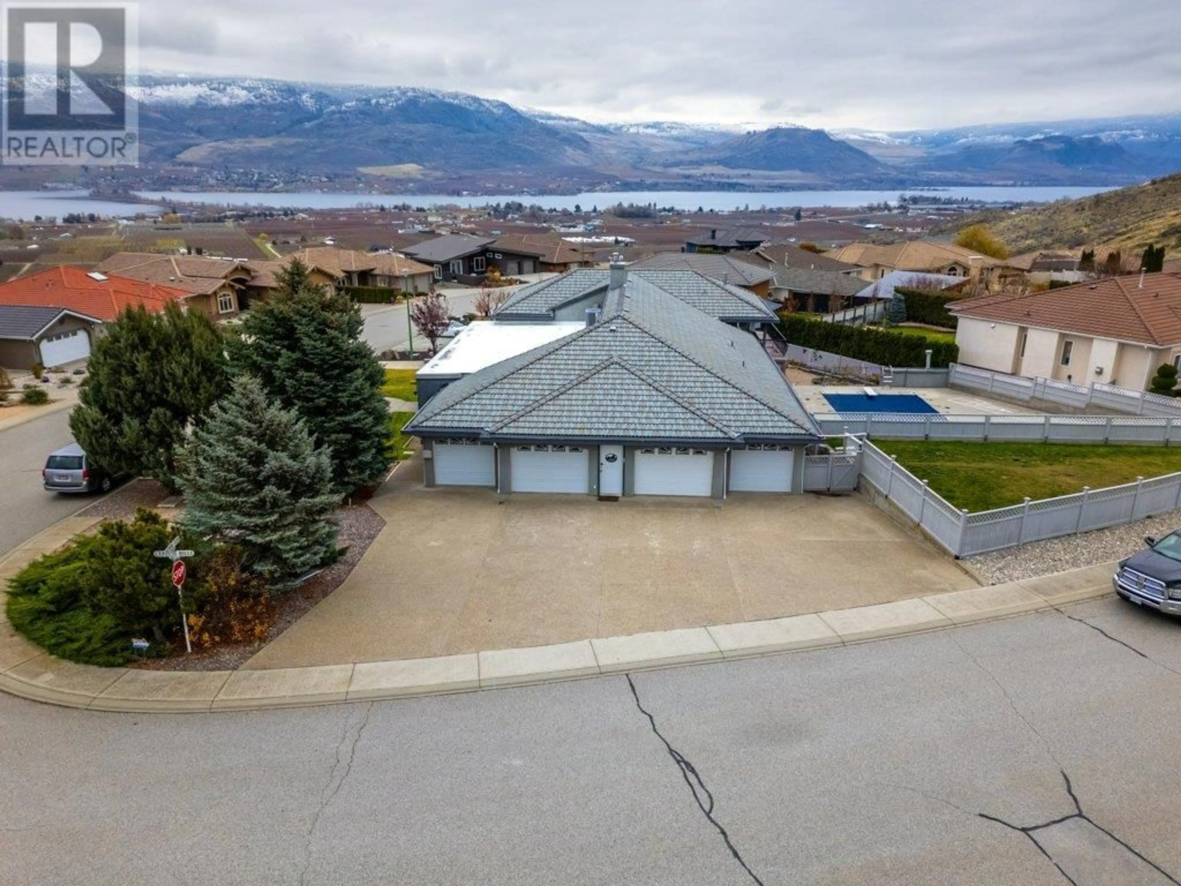 A pic from outside/outdoor area/front of a property/back of a property/a pic from drone, mountain view for 11710 Olympic View Drive, Osoyoos British Columbia V0H1H4