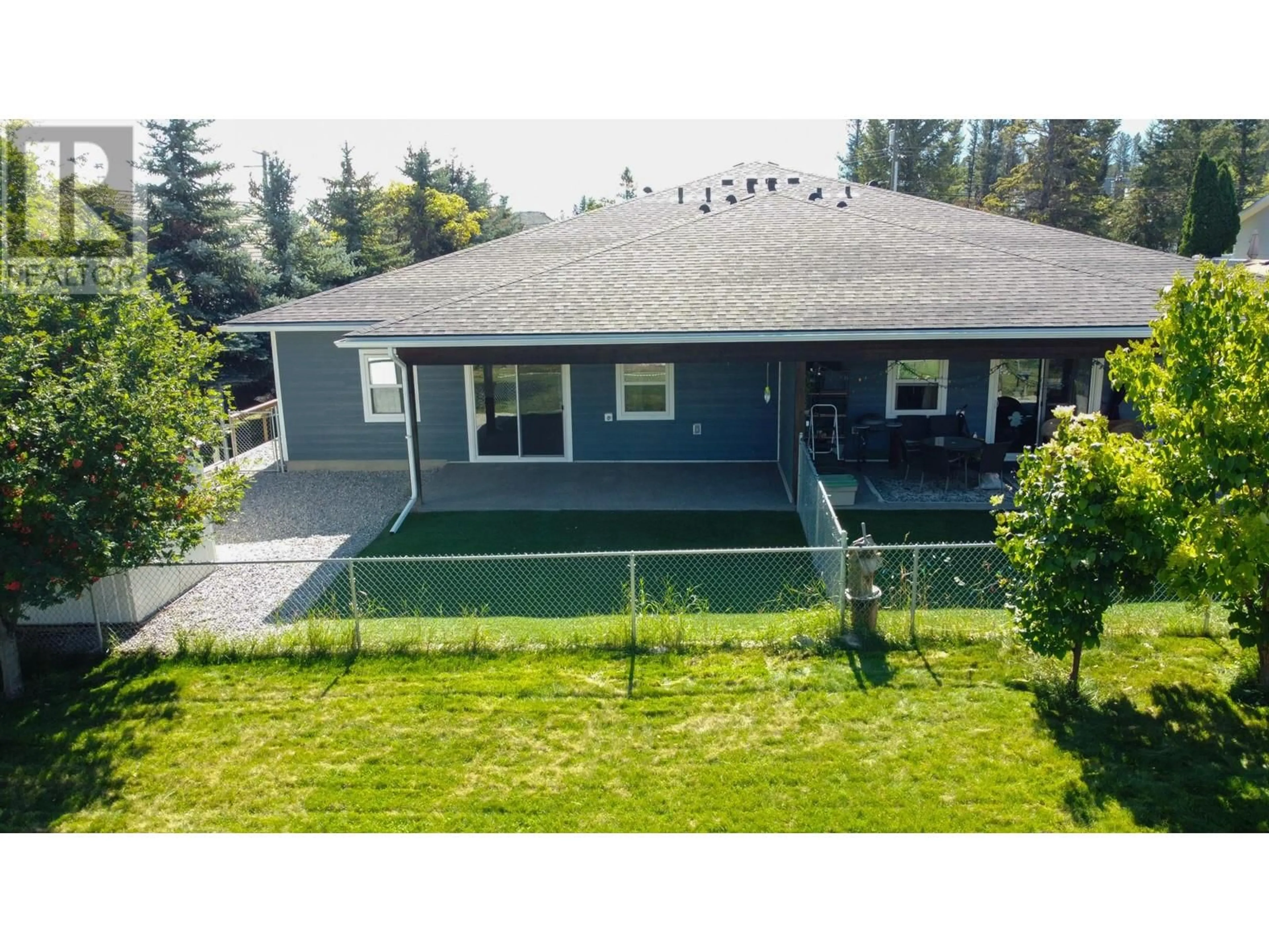 Frontside or backside of a home, the fenced backyard for 1118 10TH Street, Invermere British Columbia V0A1K0