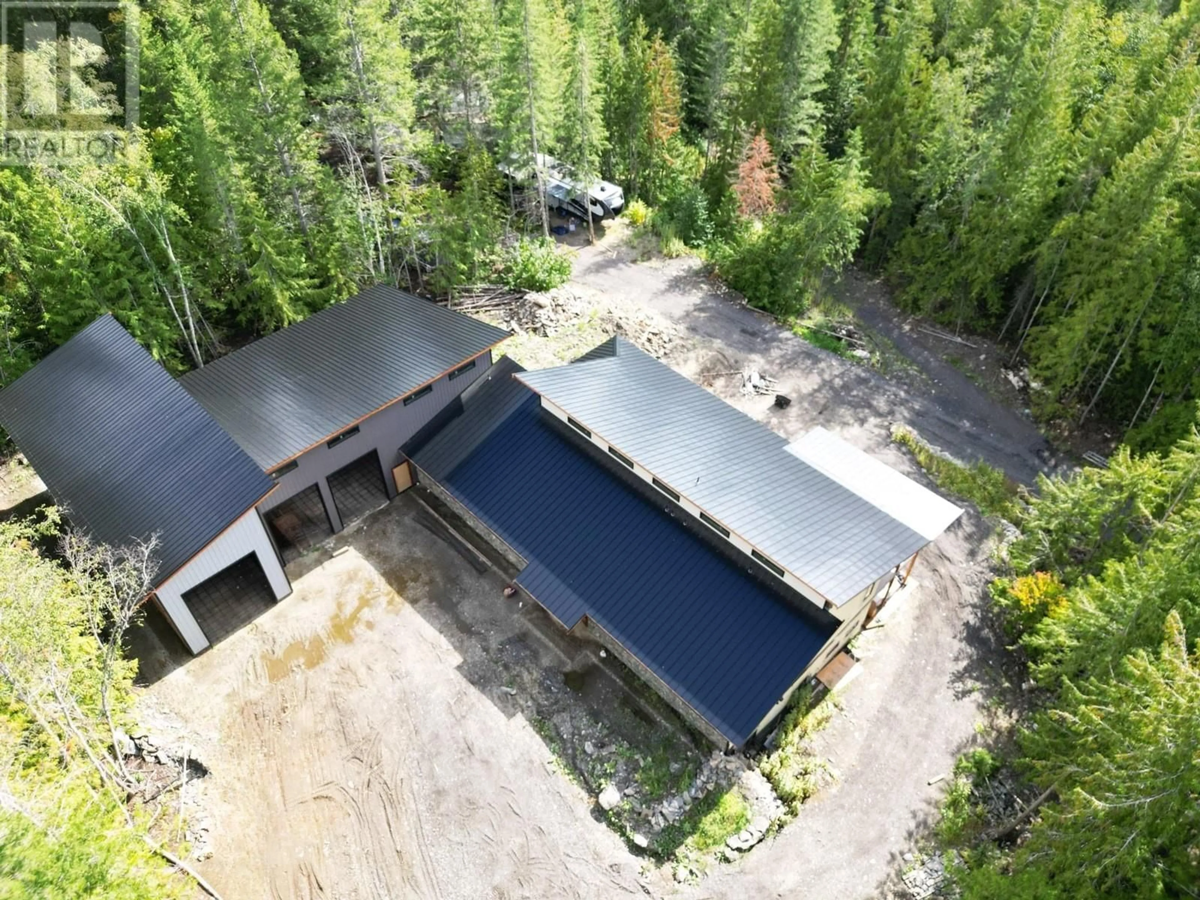 A pic from outside/outdoor area/front of a property/back of a property/a pic from drone, forest/trees view for 40 LIDSTONE ROAD, Salmon Arm British Columbia V1E2Y1