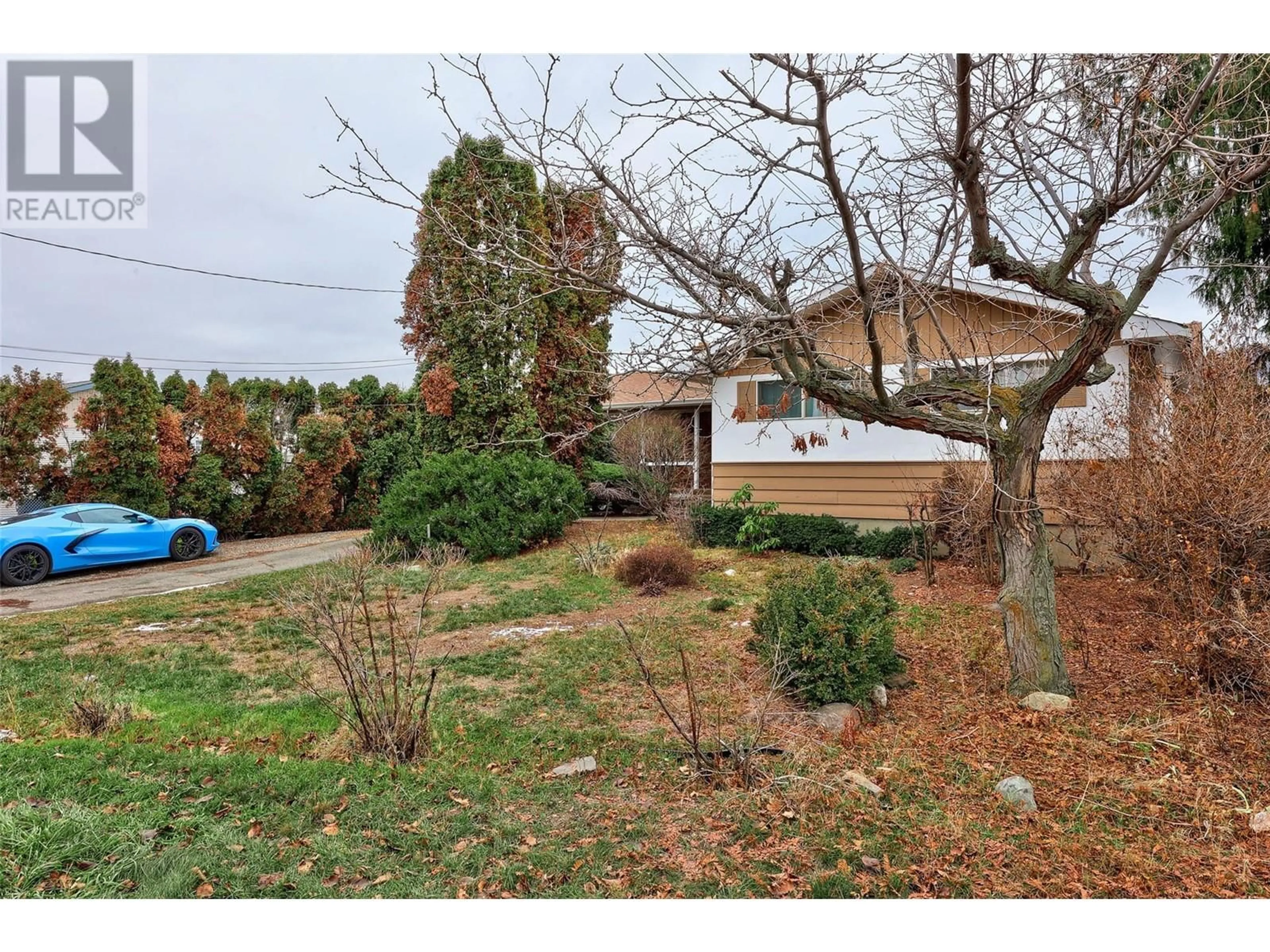 Frontside or backside of a home, the fenced backyard for 1851 PARKCREST AVE Avenue, Kamloops British Columbia V2B4W8