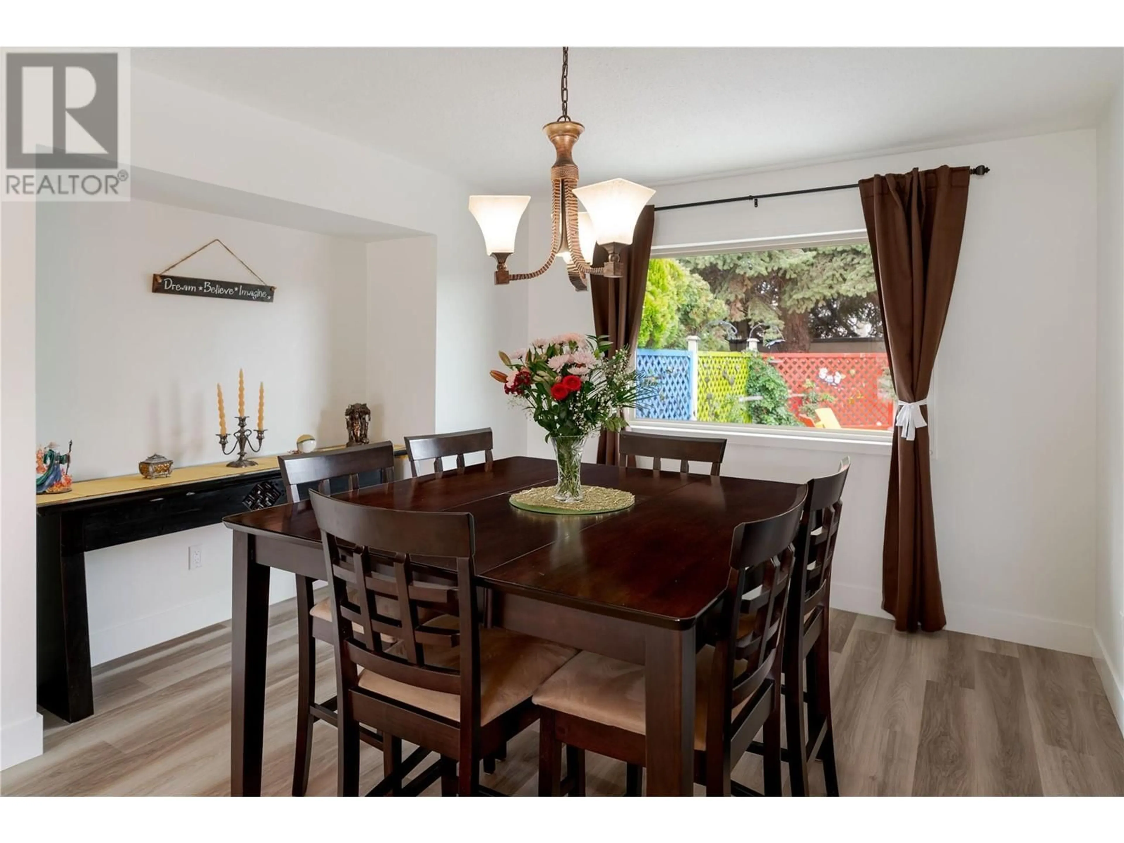 Dining room, wood/laminate floor for 600 Welke Road, Kelowna British Columbia V1W1A7