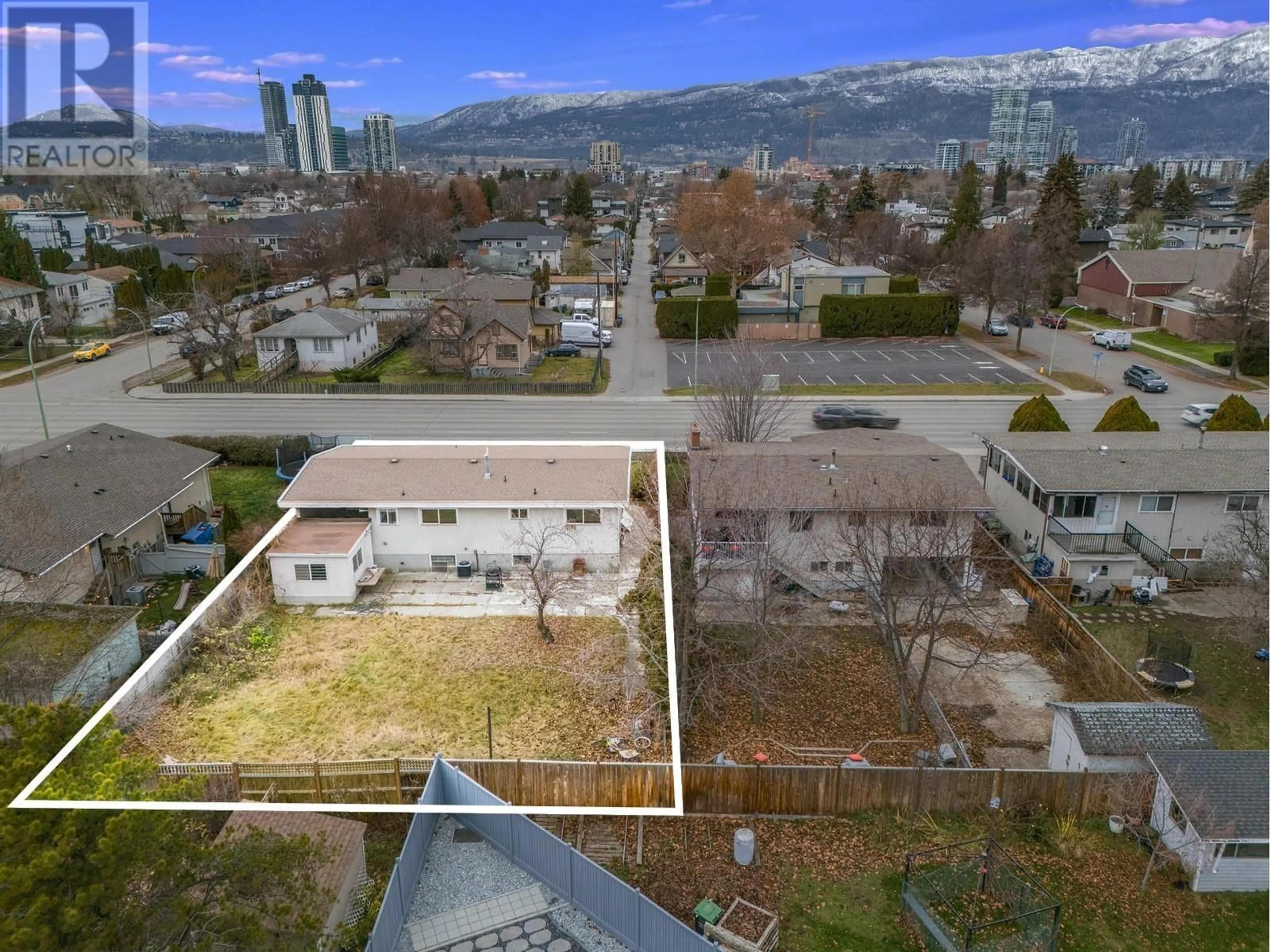 A pic from outside/outdoor area/front of a property/back of a property/a pic from drone, mountain view for 1395 Gordon Drive, Kelowna British Columbia V1Y3E9