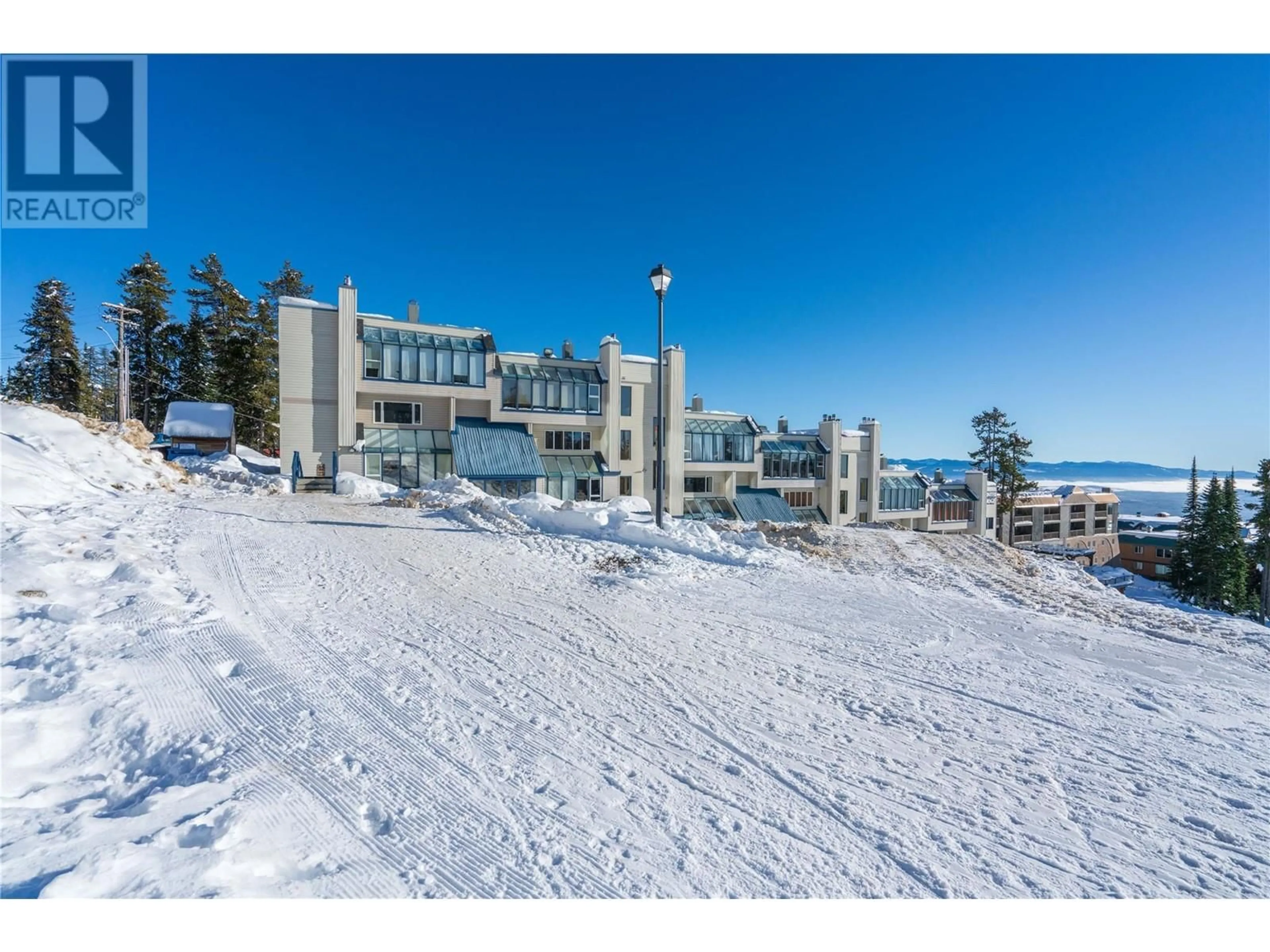 A pic from outside/outdoor area/front of a property/back of a property/a pic from drone, mountain view for B6 - 7375 PORCUPINE ROAD, Big White British Columbia V1P1P3