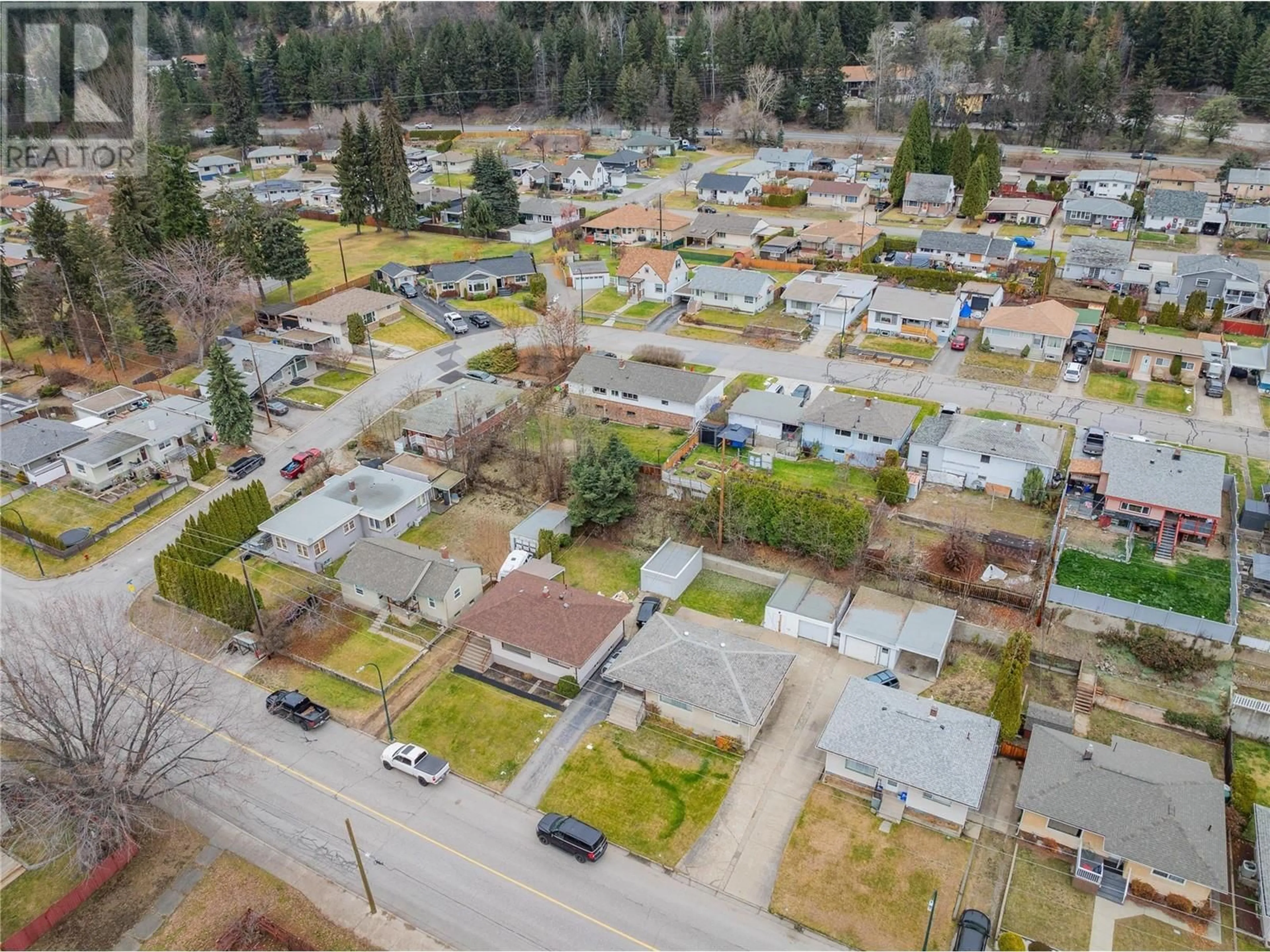 A pic from outside/outdoor area/front of a property/back of a property/a pic from drone, street for 3321 Highway Drive, Trail British Columbia V1R2T6