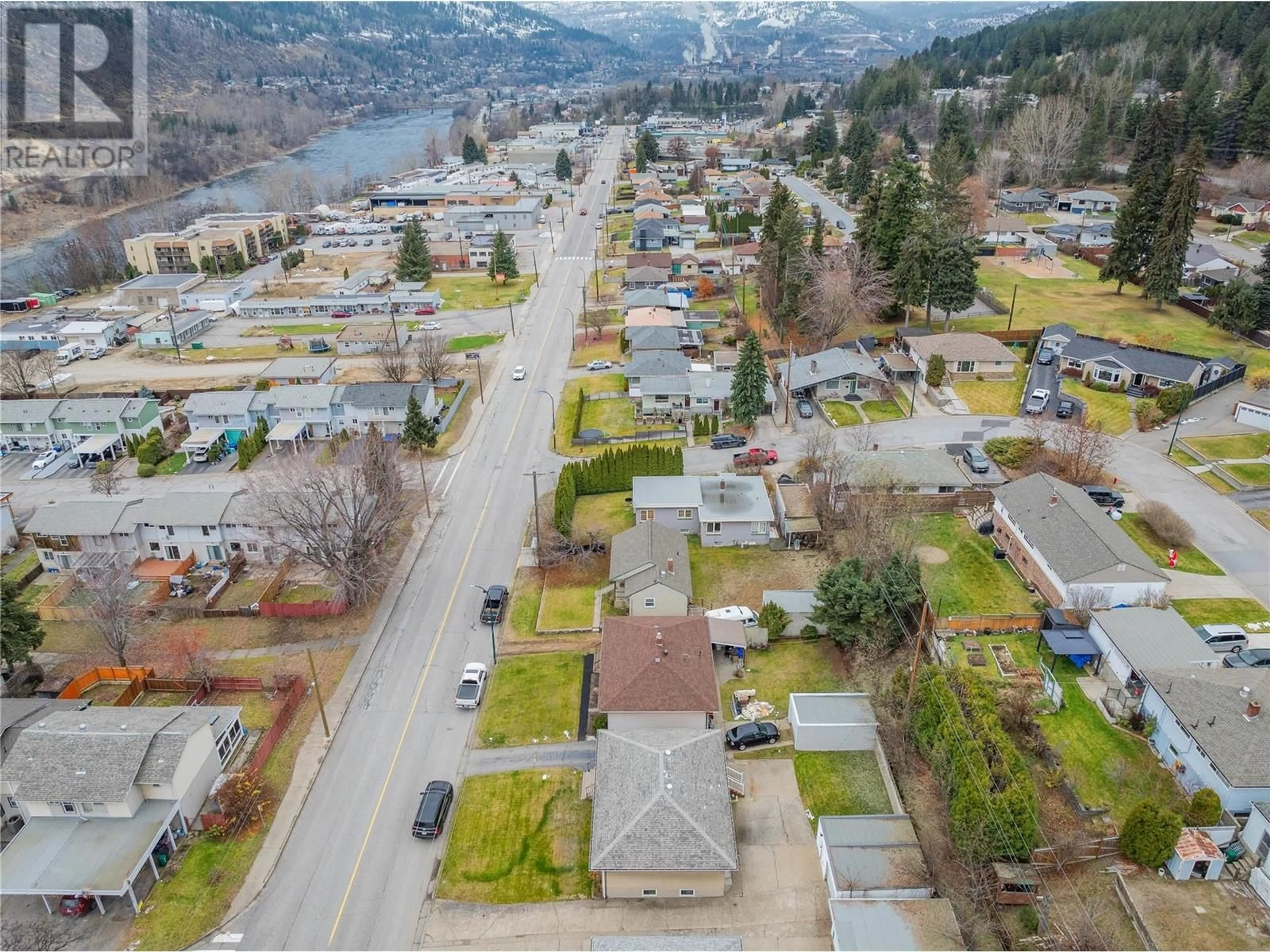 A pic from outside/outdoor area/front of a property/back of a property/a pic from drone, street for 3321 Highway Drive, Trail British Columbia V1R2T6