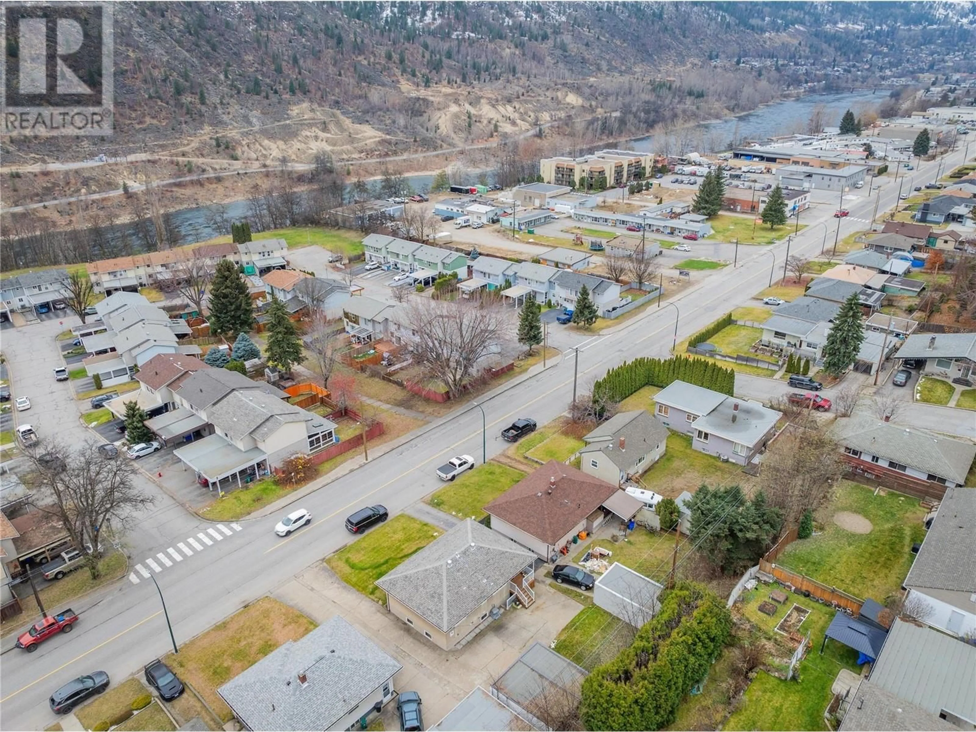 A pic from outside/outdoor area/front of a property/back of a property/a pic from drone, street for 3321 Highway Drive, Trail British Columbia V1R2T6