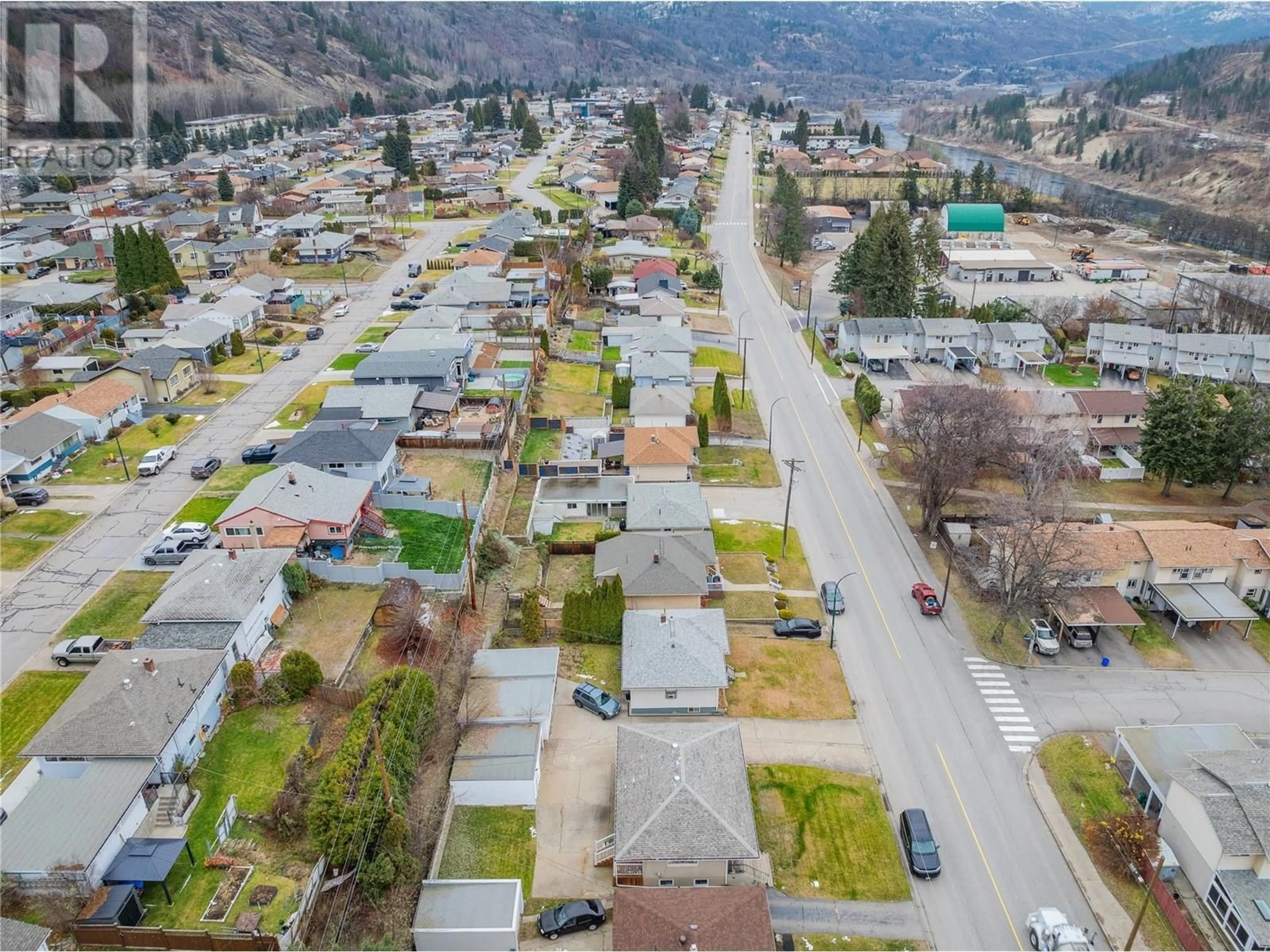 A pic from outside/outdoor area/front of a property/back of a property/a pic from drone, street for 3321 Highway Drive, Trail British Columbia V1R2T6