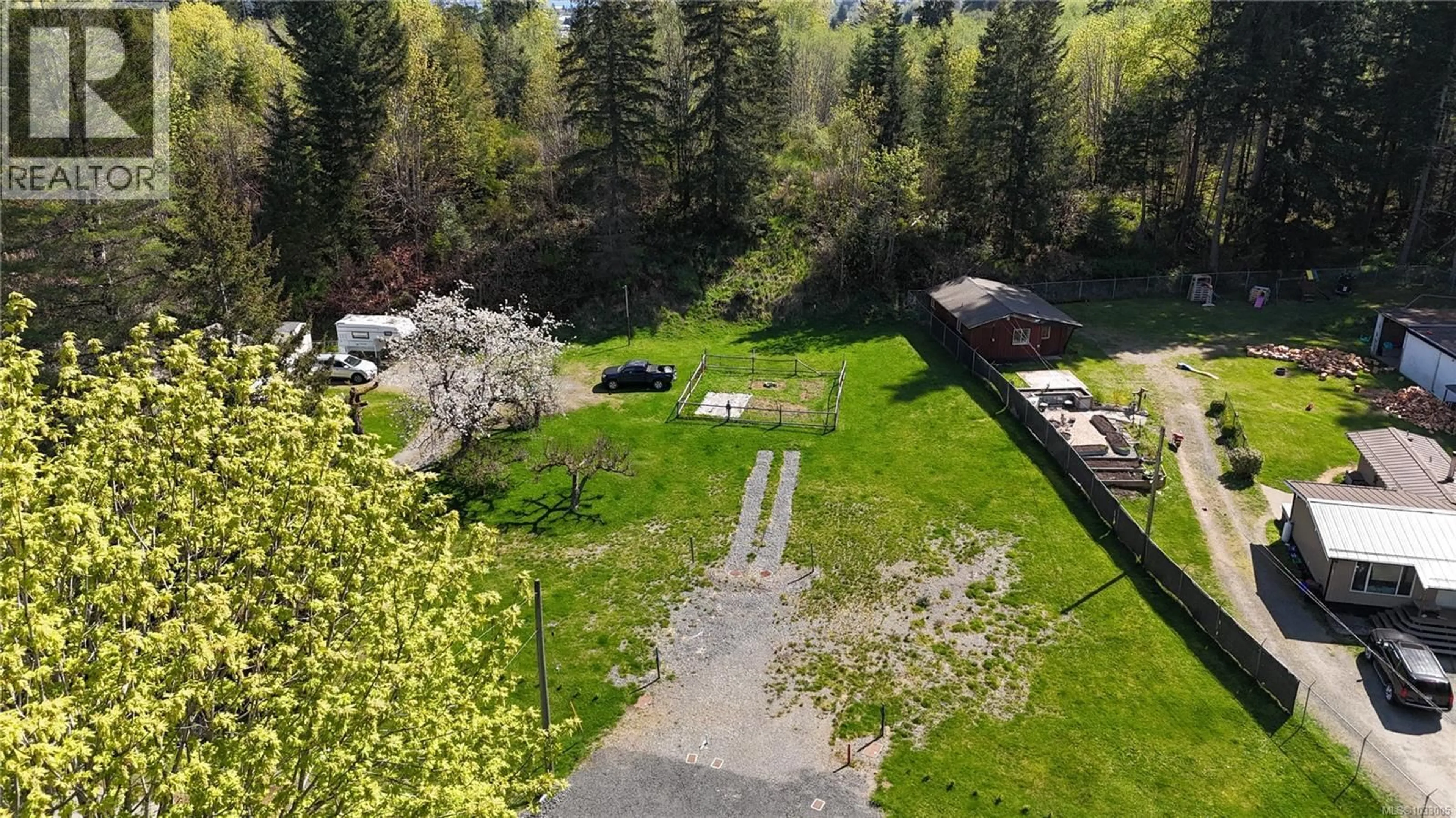 A pic from outside/outdoor area/front of a property/back of a property/a pic from drone, forest/trees view for B - 1655 NURSERY ROAD, Campbell River British Columbia V9W4V4
