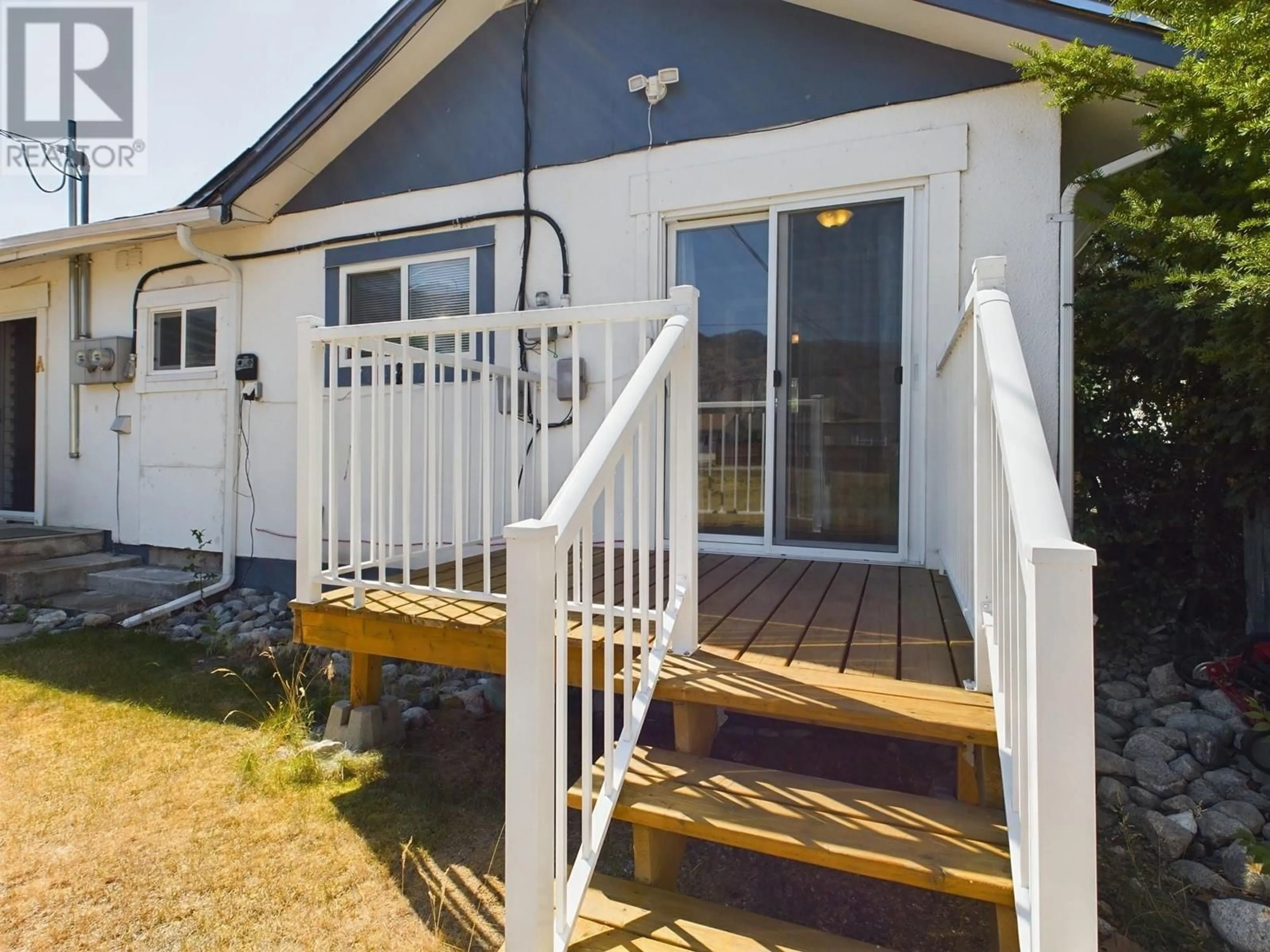 Home with vinyl exterior material, street for 6215 MAPLE DRIVE, Osoyoos British Columbia V0H1V4