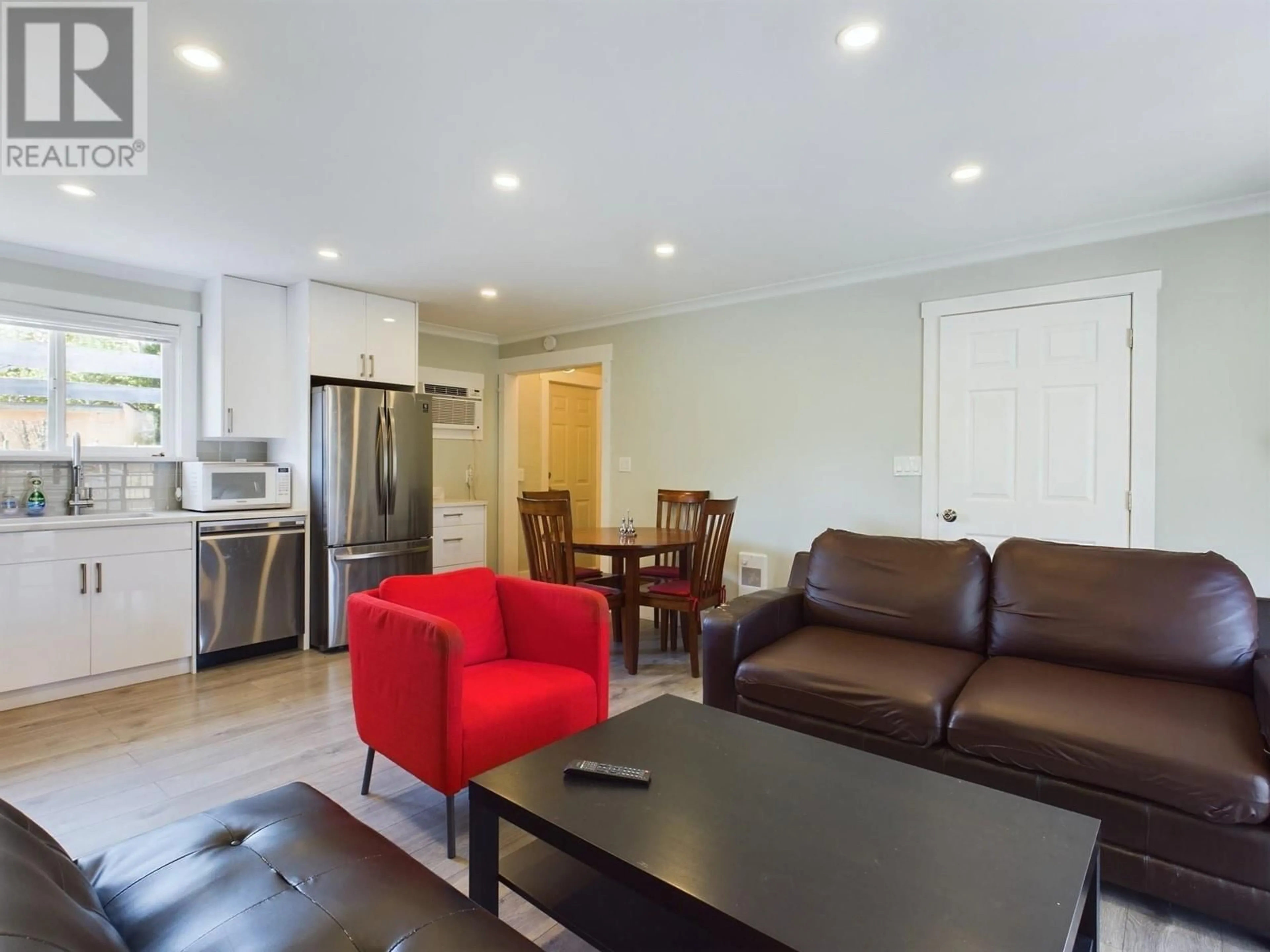 Living room with furniture, wood/laminate floor for 6215 MAPLE DRIVE, Osoyoos British Columbia V0H1V4