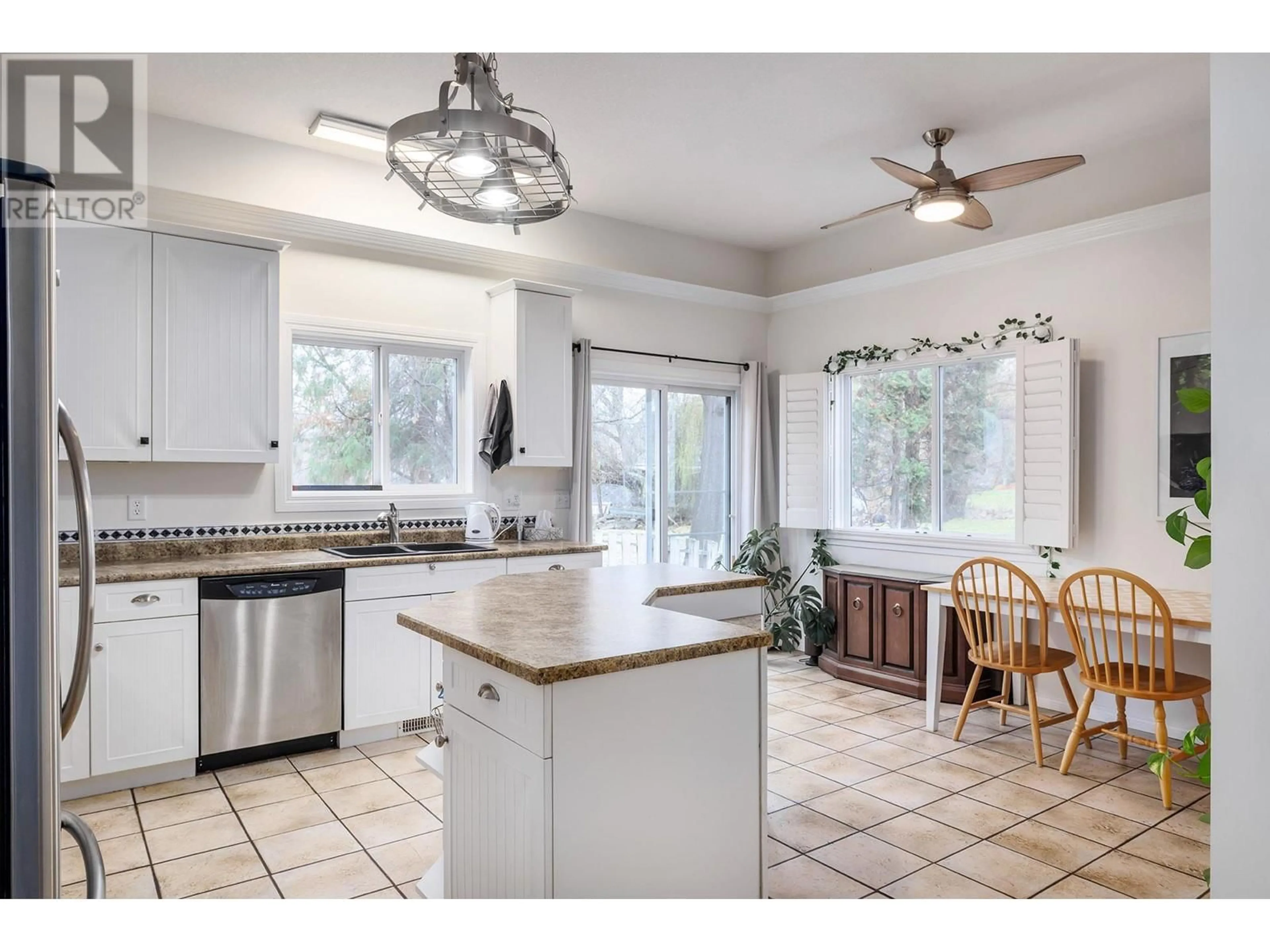 Open concept kitchen, ceramic/tile floor for 615 Sutherland Avenue, Kelowna British Columbia V1Y5X3