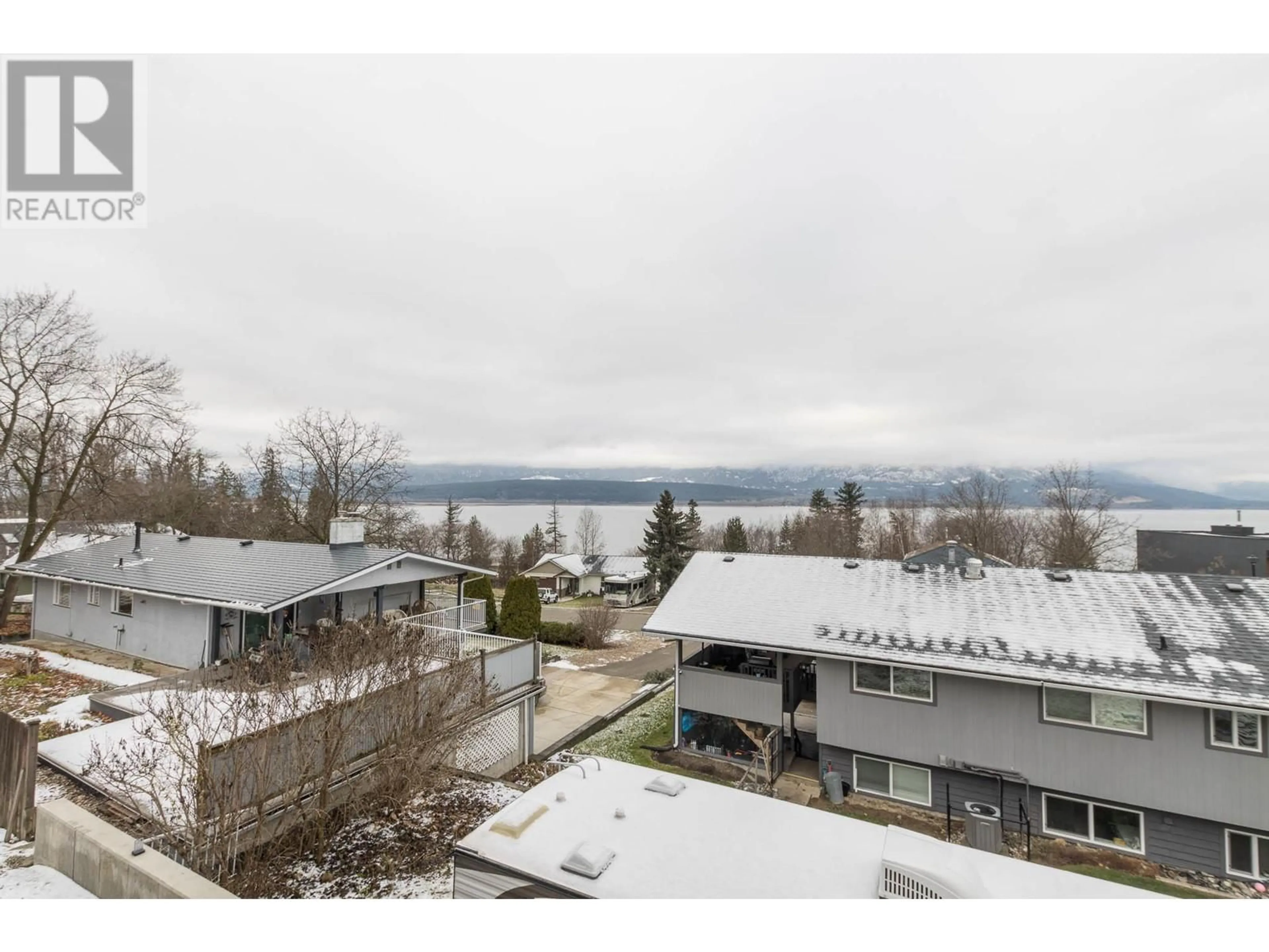 A pic from outside/outdoor area/front of a property/back of a property/a pic from drone, water/lake/river/ocean view for 1770 27 Avenue NE, Salmon Arm British Columbia V1E3X4