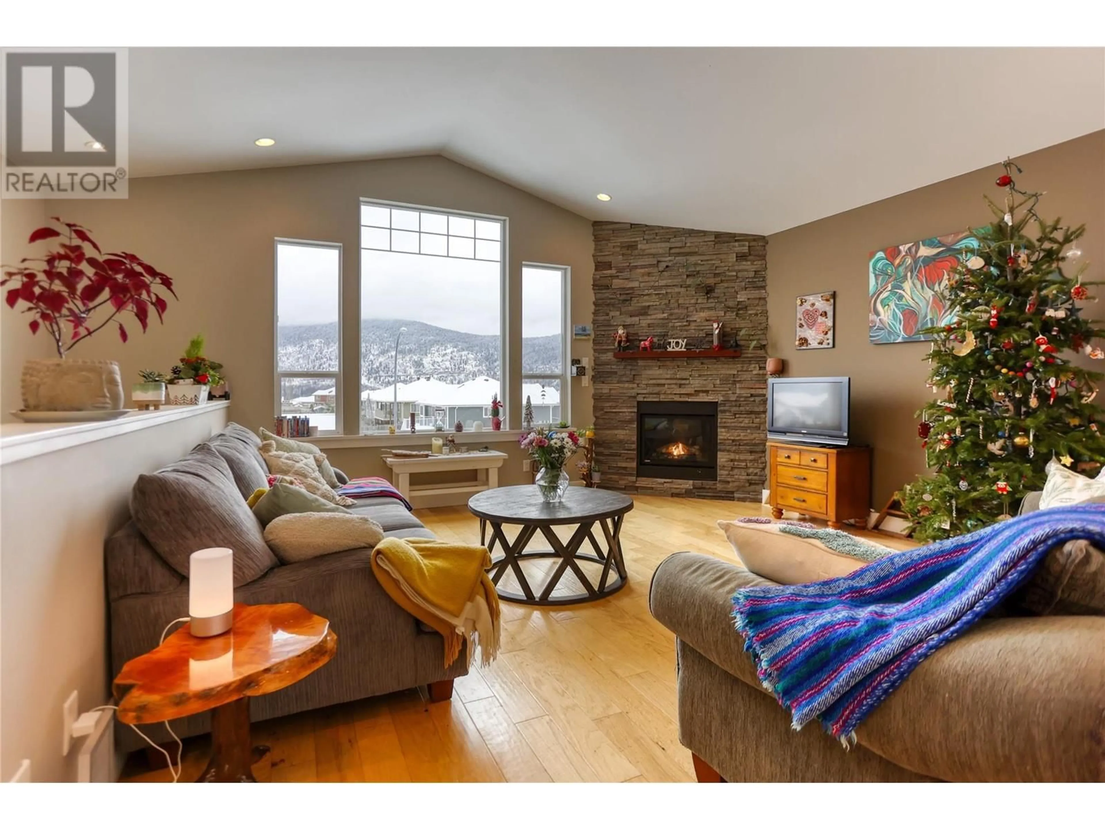 Living room with furniture, wood/laminate floor for 4104 16th Avenue, Castlegar British Columbia V1N4X7