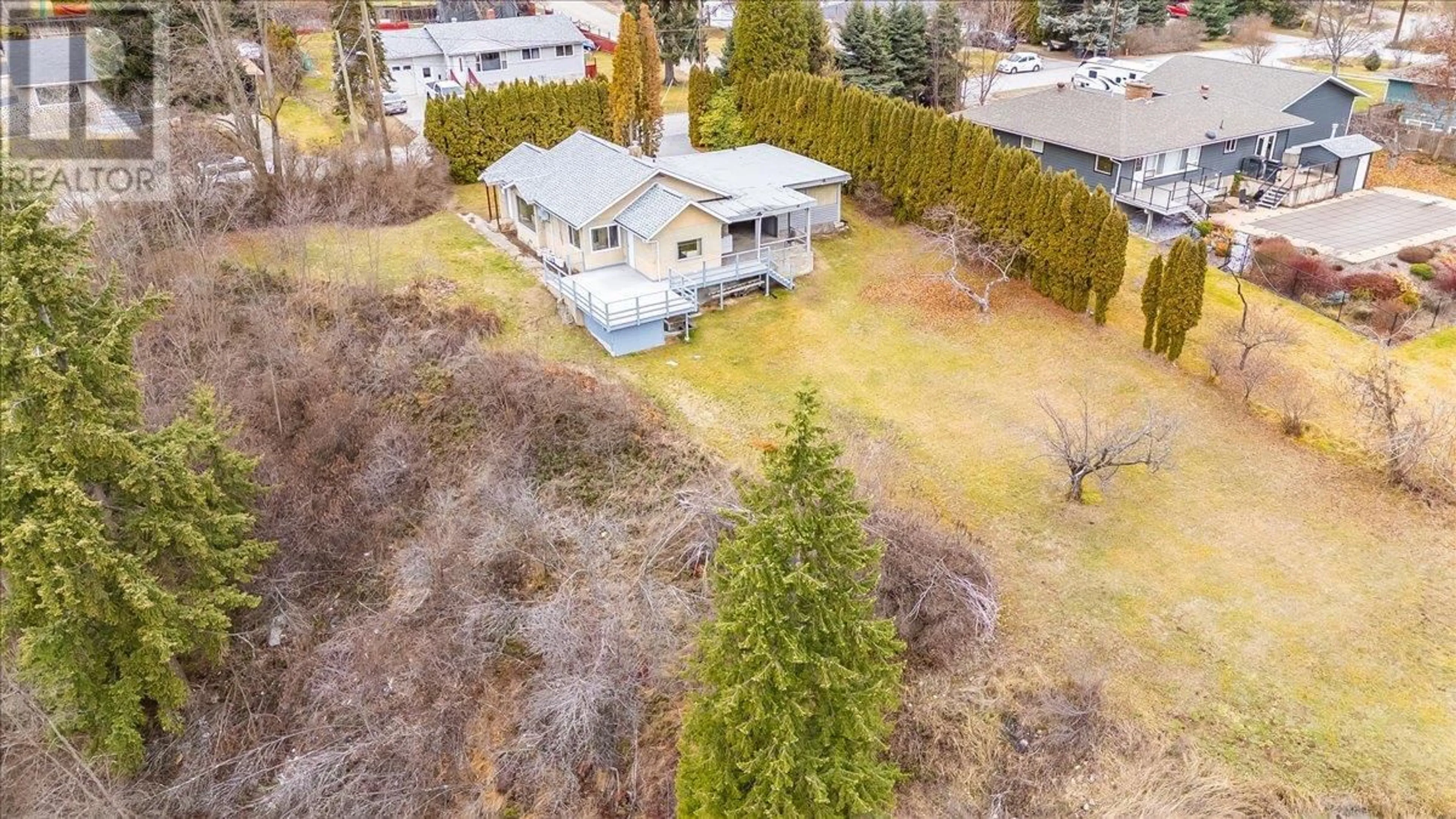 Frontside or backside of a home, the fenced backyard for 3601 3rd Avenue, Castlegar British Columbia V1N2R7