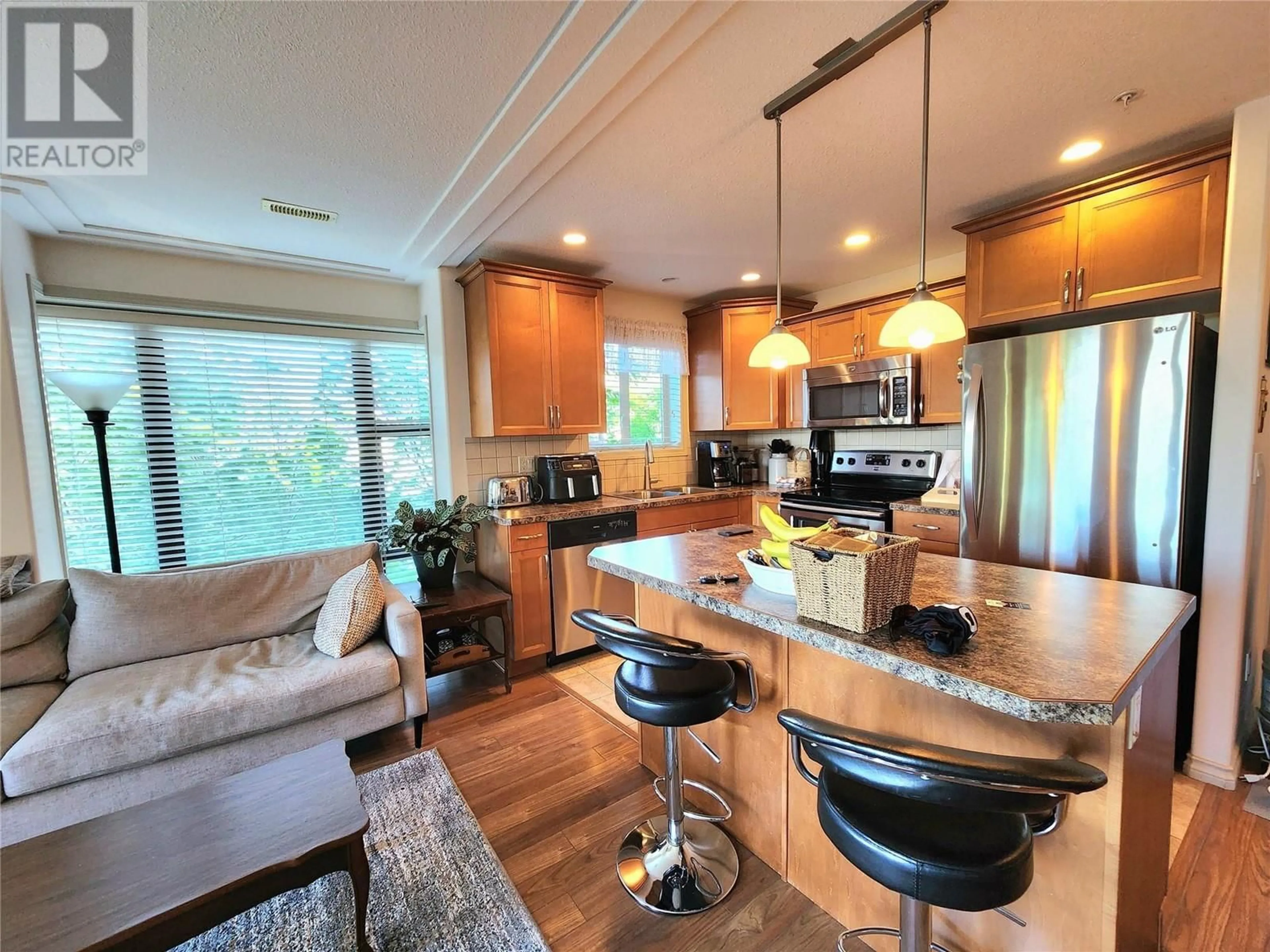Open concept kitchen, wood/laminate floor for 302 - 2125 ATKINSON STREET, Penticton British Columbia V2A9E6