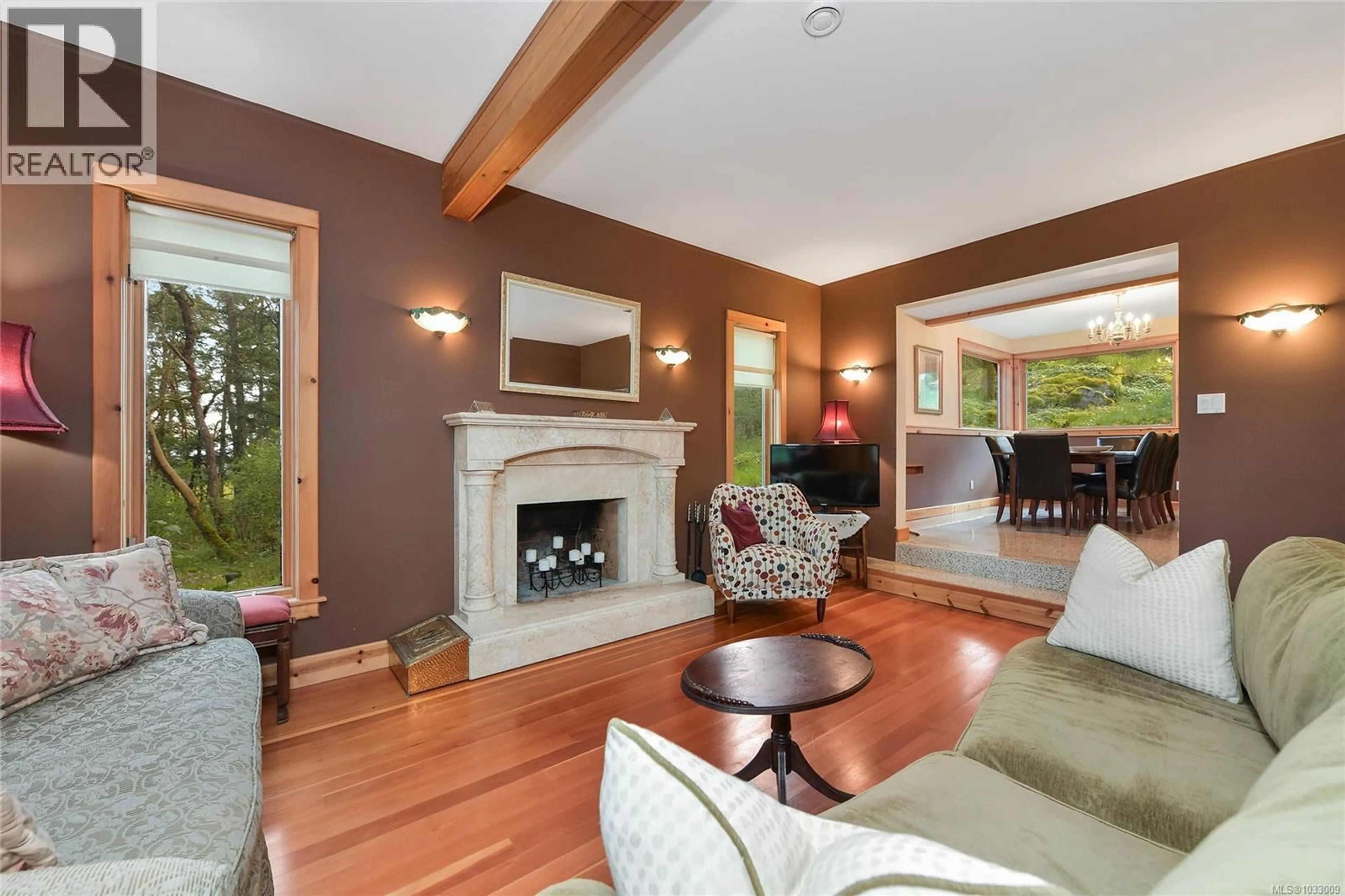 Living room with furniture, wood/laminate floor for 4836 SPRING ROAD, Saanich British Columbia V9E2E4