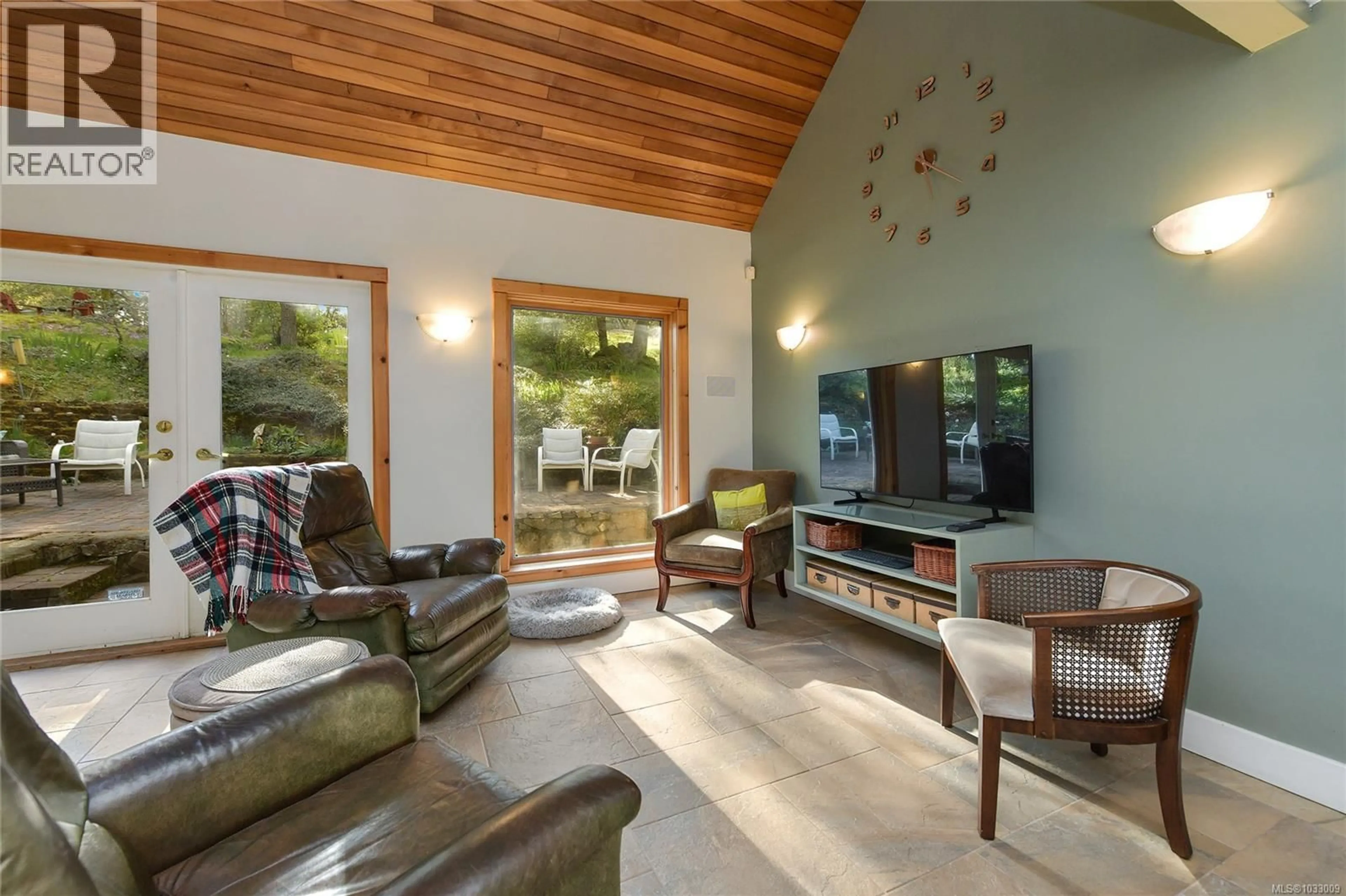 Living room with furniture, wood/laminate floor for 4836 SPRING ROAD, Saanich British Columbia V9E2E4