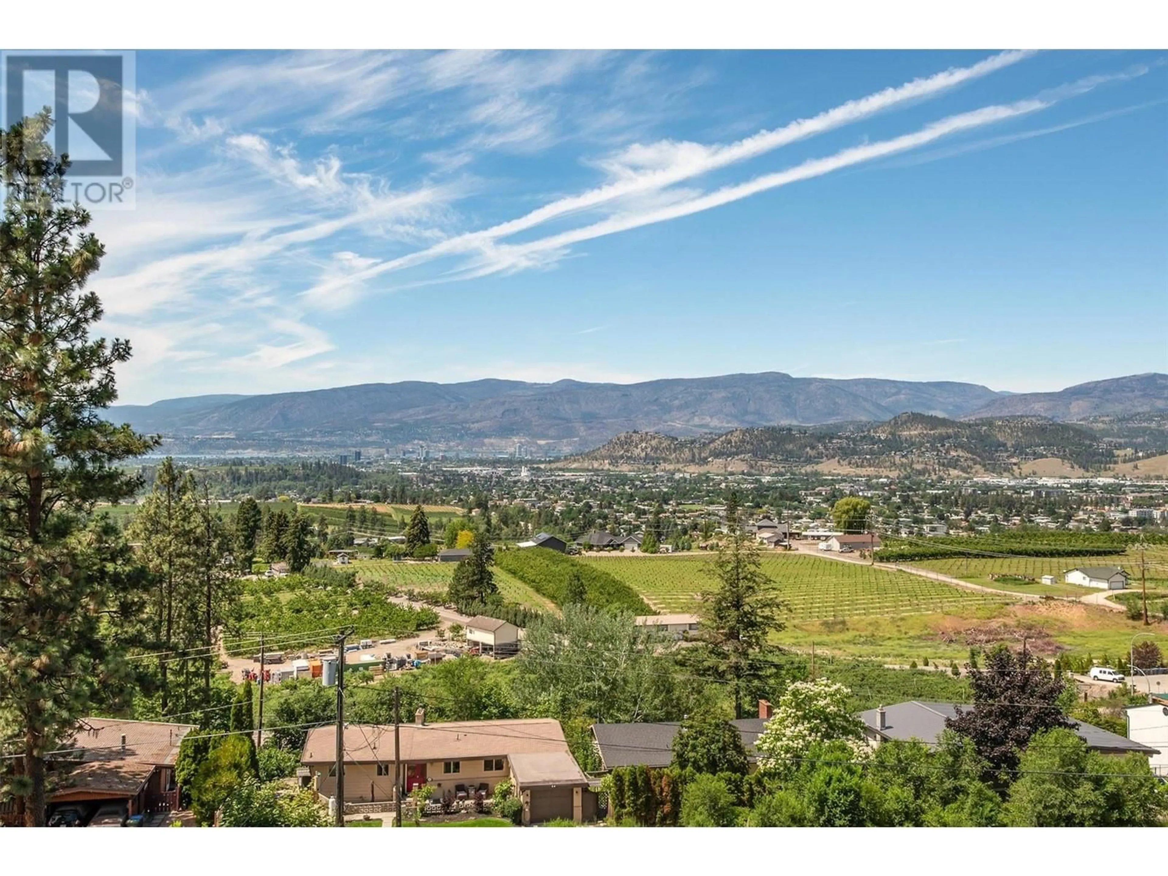 A pic from outside/outdoor area/front of a property/back of a property/a pic from drone, mountain view for 1044 James Hockey Place, Kelowna British Columbia V1X7L2