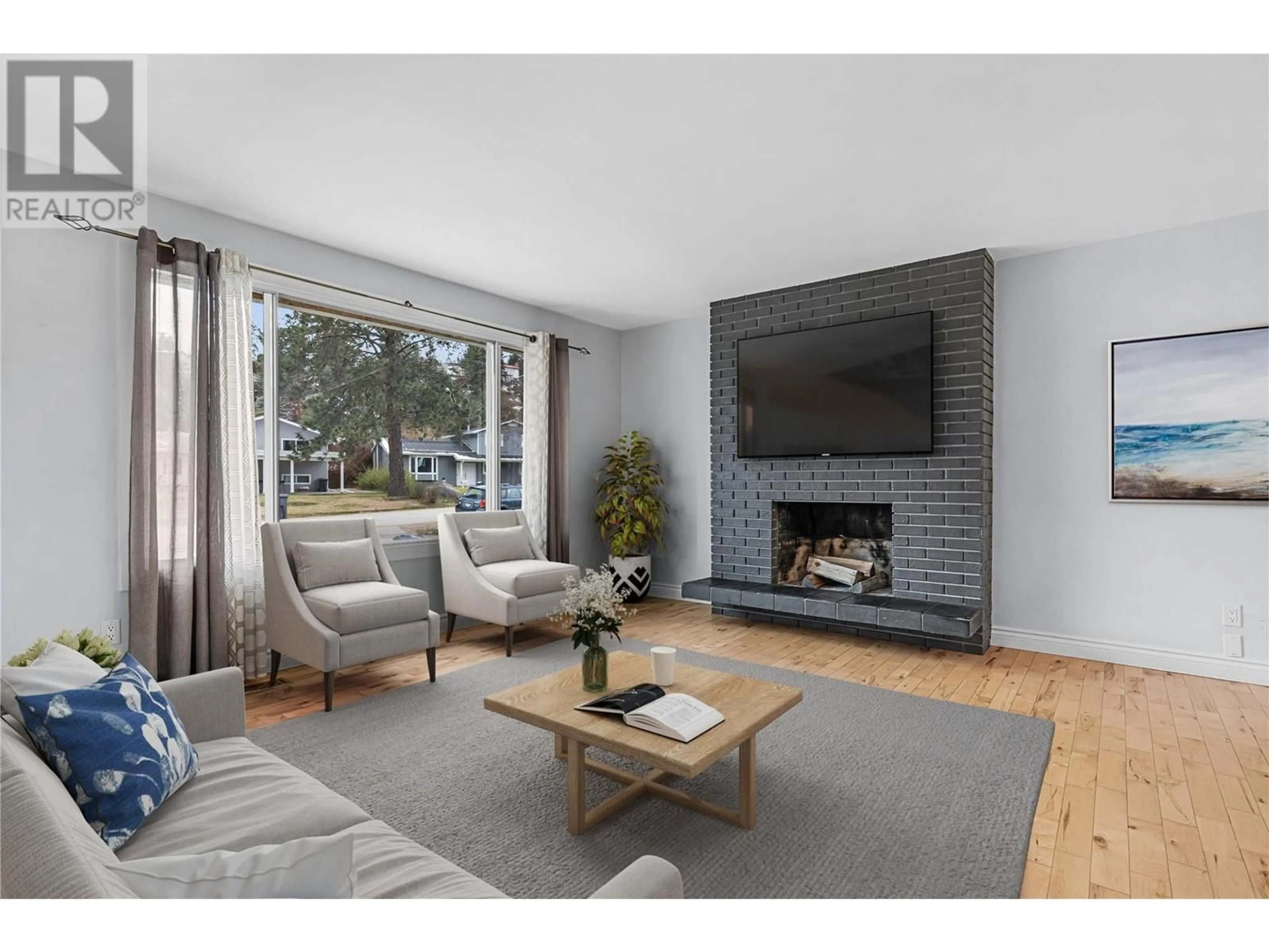 Living room with furniture, wood/laminate floor for 3309 McMahon Road, West Kelowna British Columbia V4T1W6