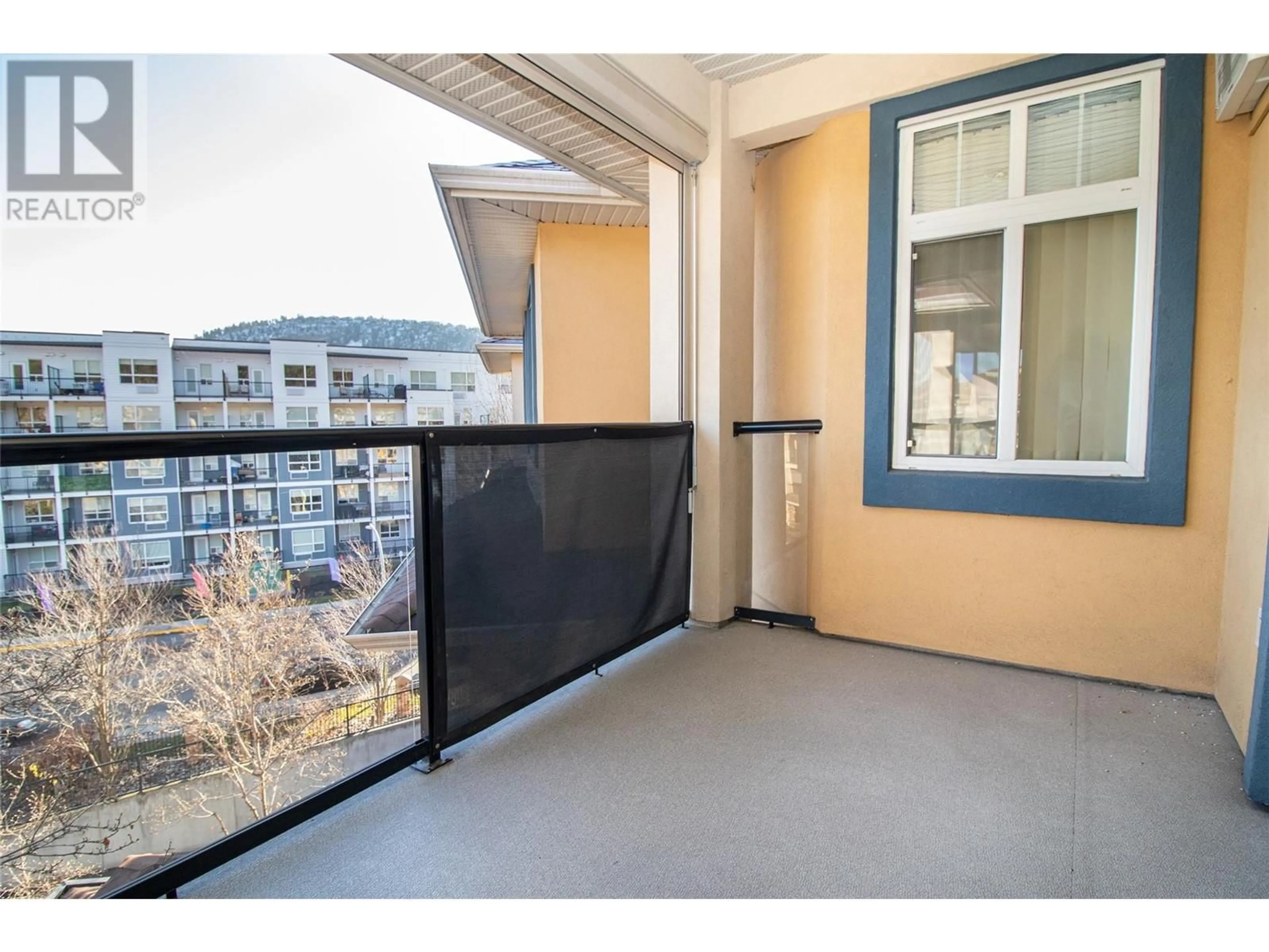 Balcony in the apartment, city buildings view from balcony for 303 Whitman Road Unit# 403, Kelowna British Columbia V1V2P3