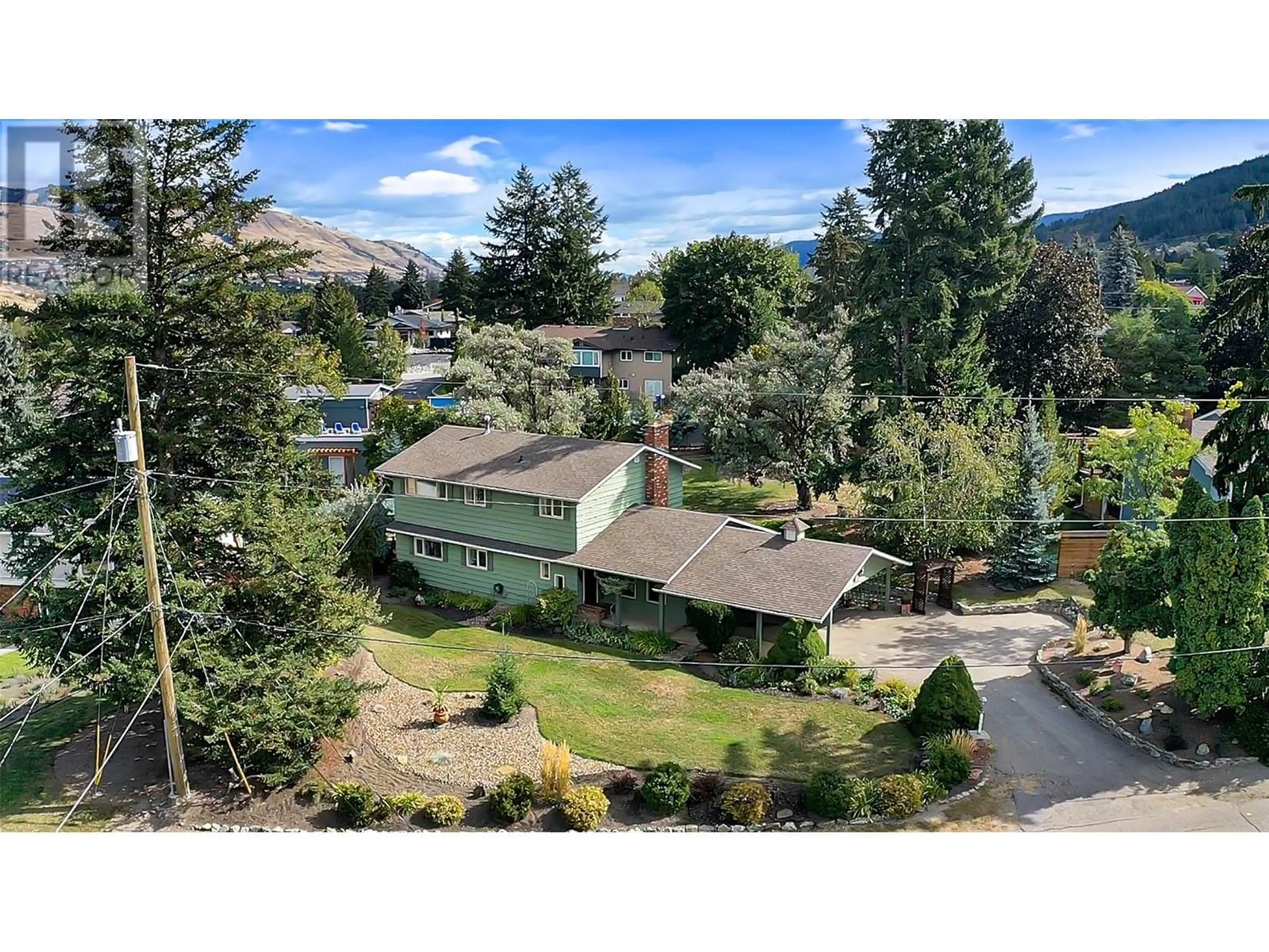 A pic from outside/outdoor area/front of a property/back of a property/a pic from drone, mountain view for 7701 Holtam Drive, Coldstream British Columbia V1B1T5