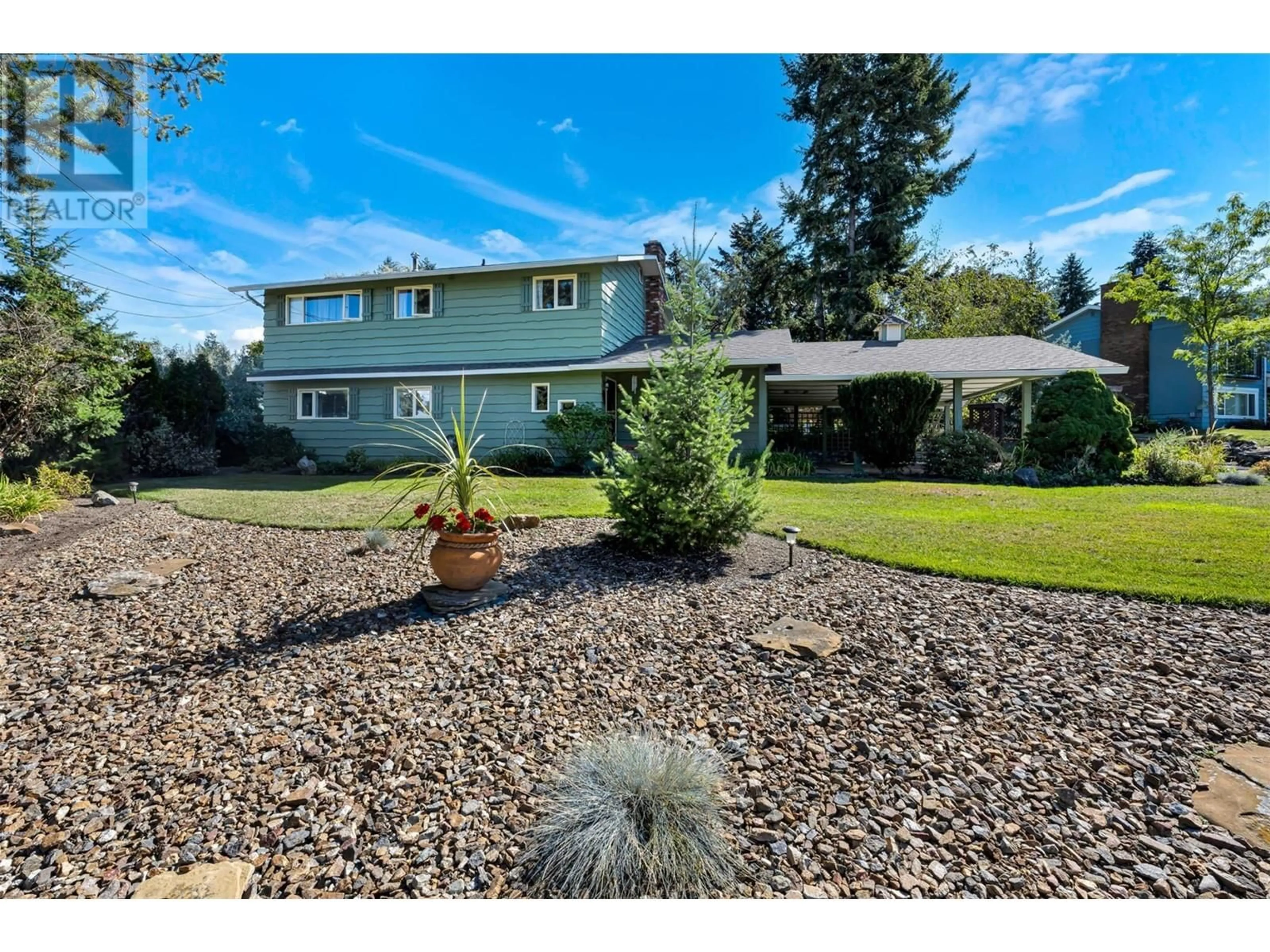 A pic from outside/outdoor area/front of a property/back of a property/a pic from drone, unknown for 7701 Holtam Drive, Coldstream British Columbia V1B1T5