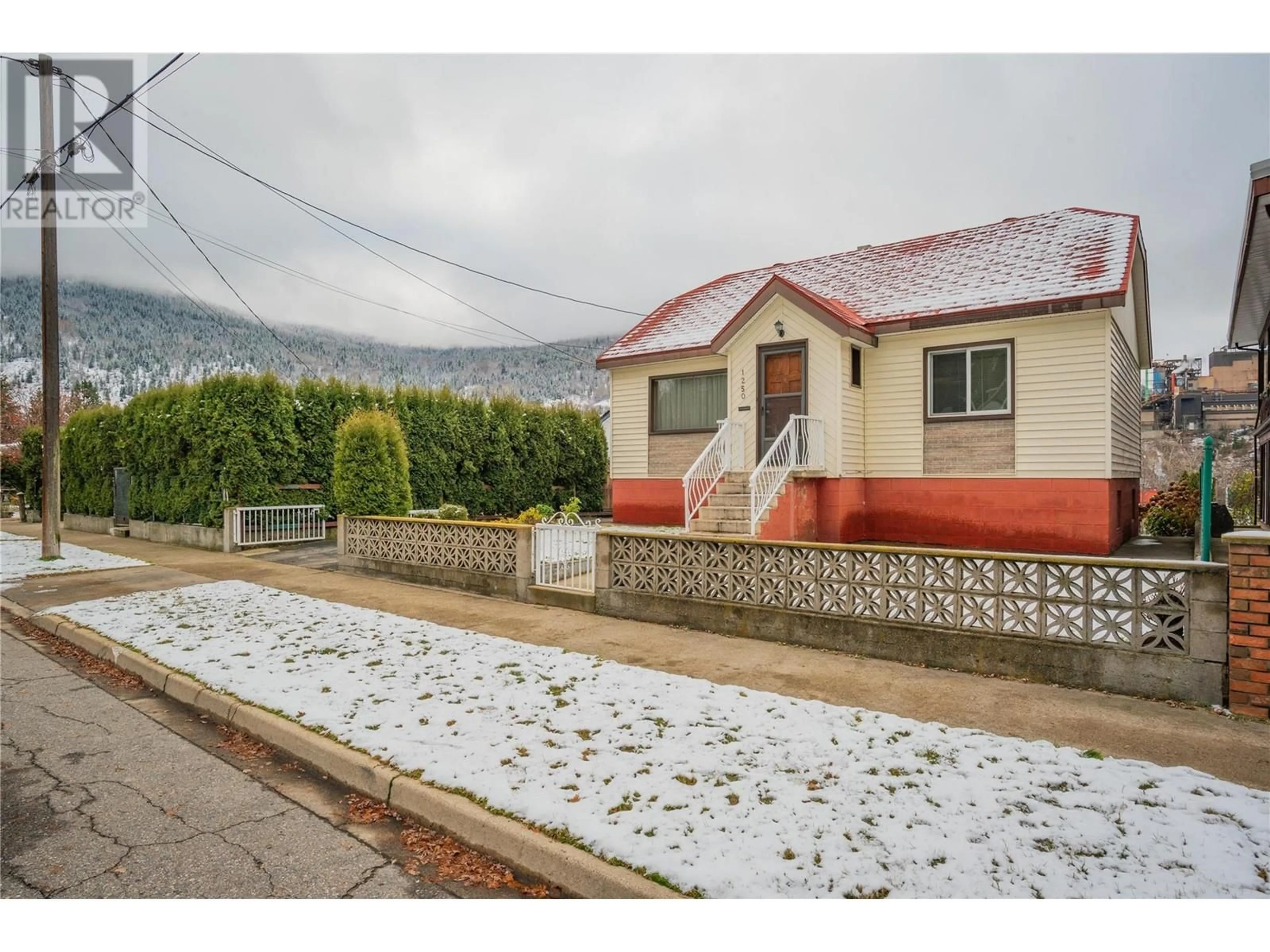 A pic from outside/outdoor area/front of a property/back of a property/a pic from drone, mountain view for 1250 Third Avenue, Trail British Columbia V1R1P2