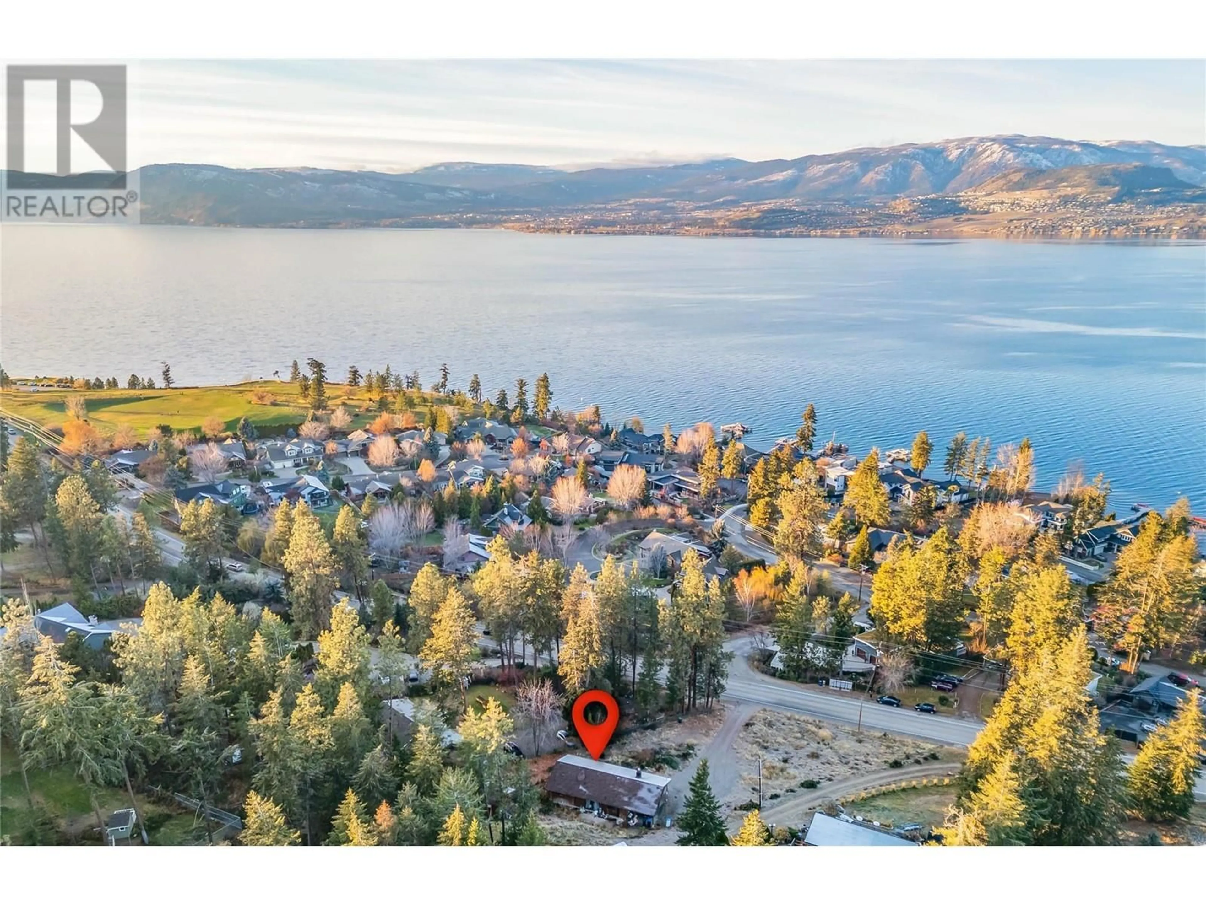 A pic from outside/outdoor area/front of a property/back of a property/a pic from drone, water/lake/river/ocean view for 5127 Lakeshore Road, Kelowna British Columbia V1W4J1