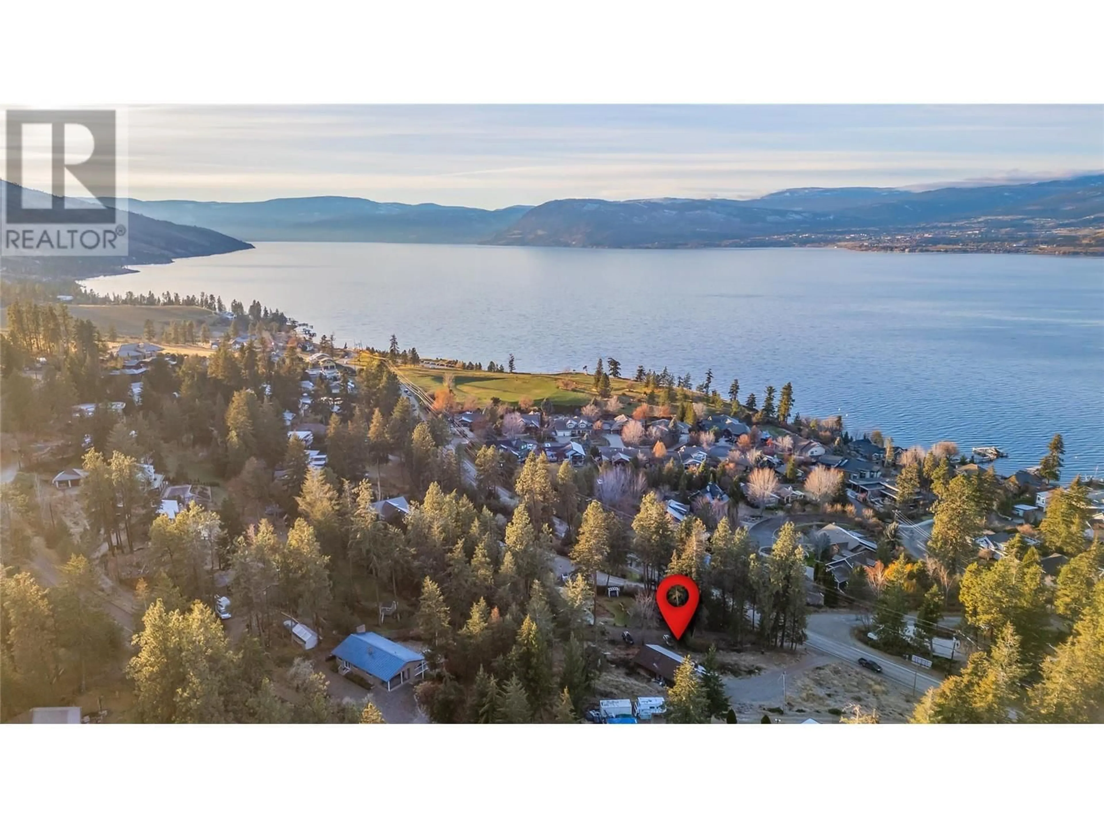 A pic from outside/outdoor area/front of a property/back of a property/a pic from drone, water/lake/river/ocean view for 5127 Lakeshore Road, Kelowna British Columbia V1W4J1