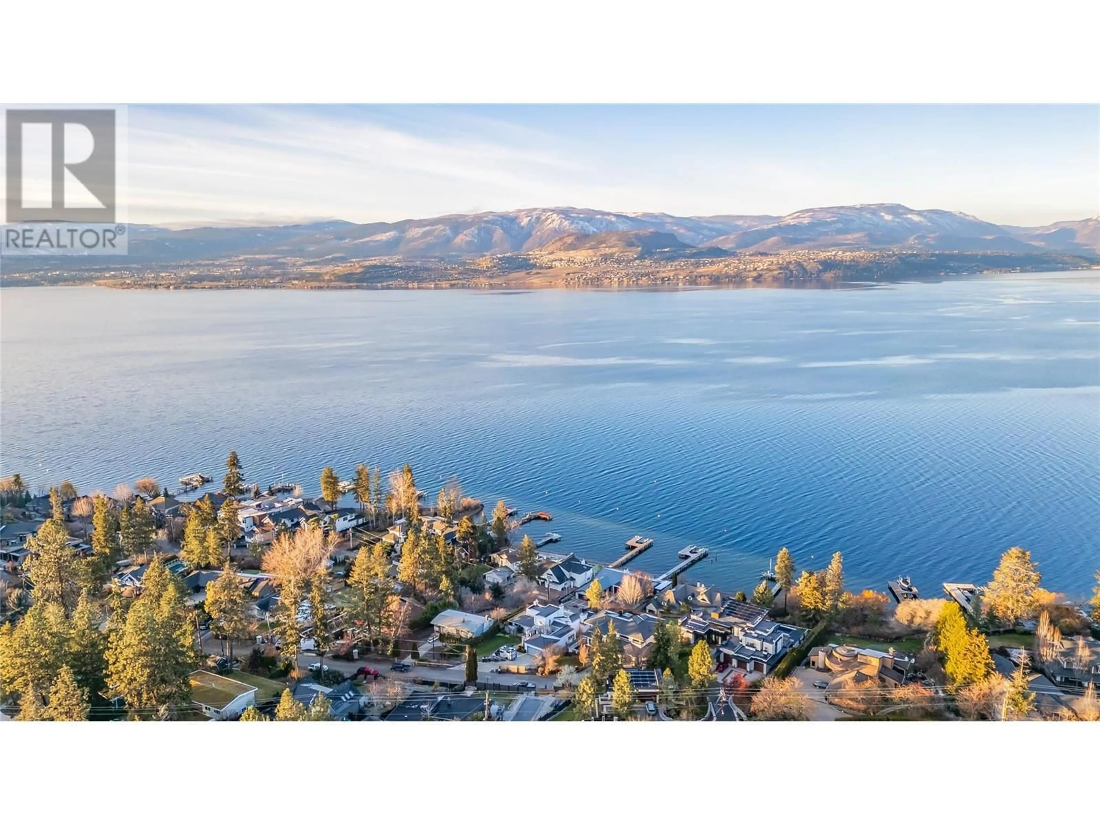 A pic from outside/outdoor area/front of a property/back of a property/a pic from drone, water/lake/river/ocean view for 5127 Lakeshore Road, Kelowna British Columbia V1W4J1