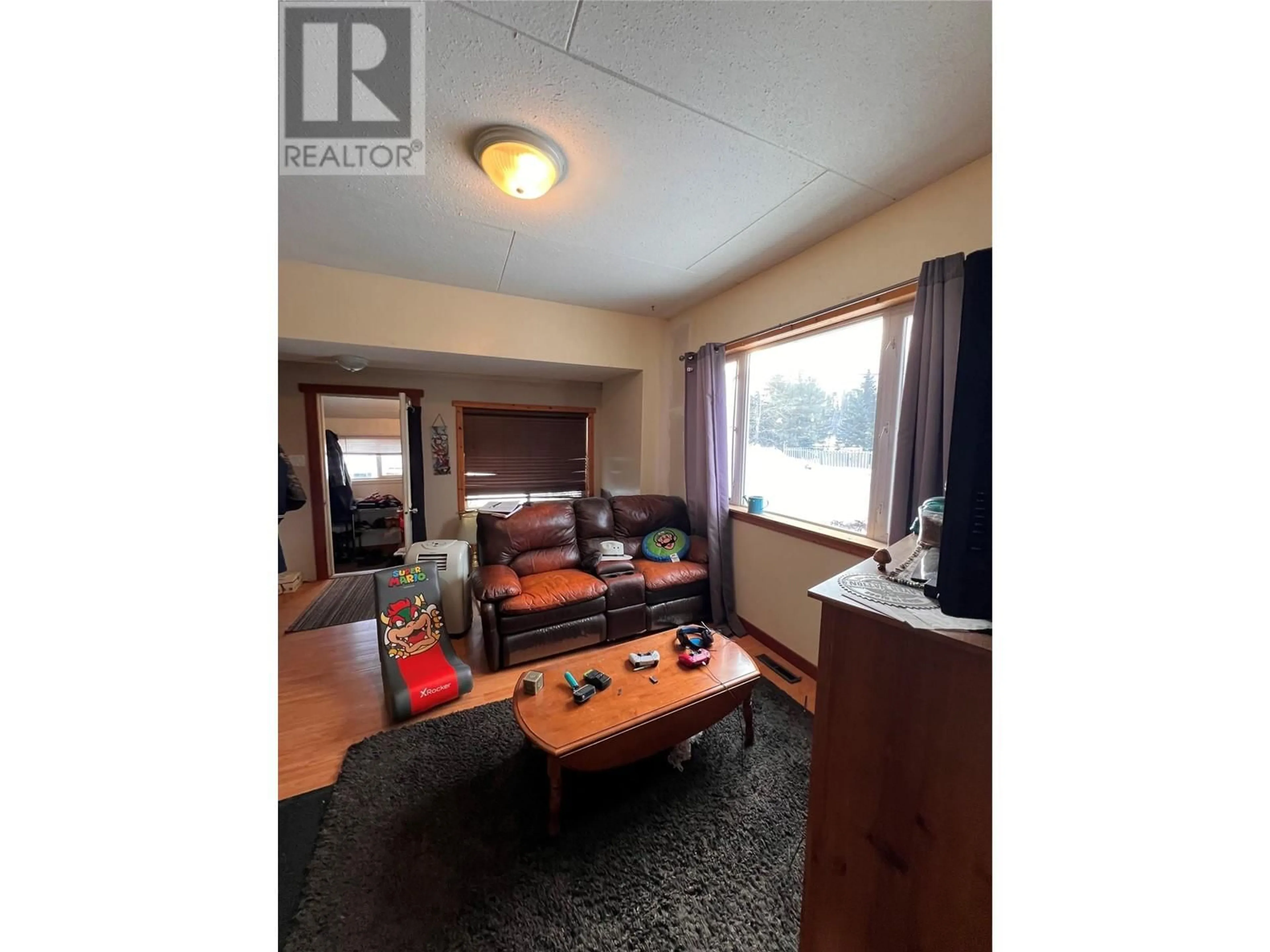 Living room with furniture, wood/laminate floor for 1171 1st Avenue, Fernie British Columbia V0B1M0