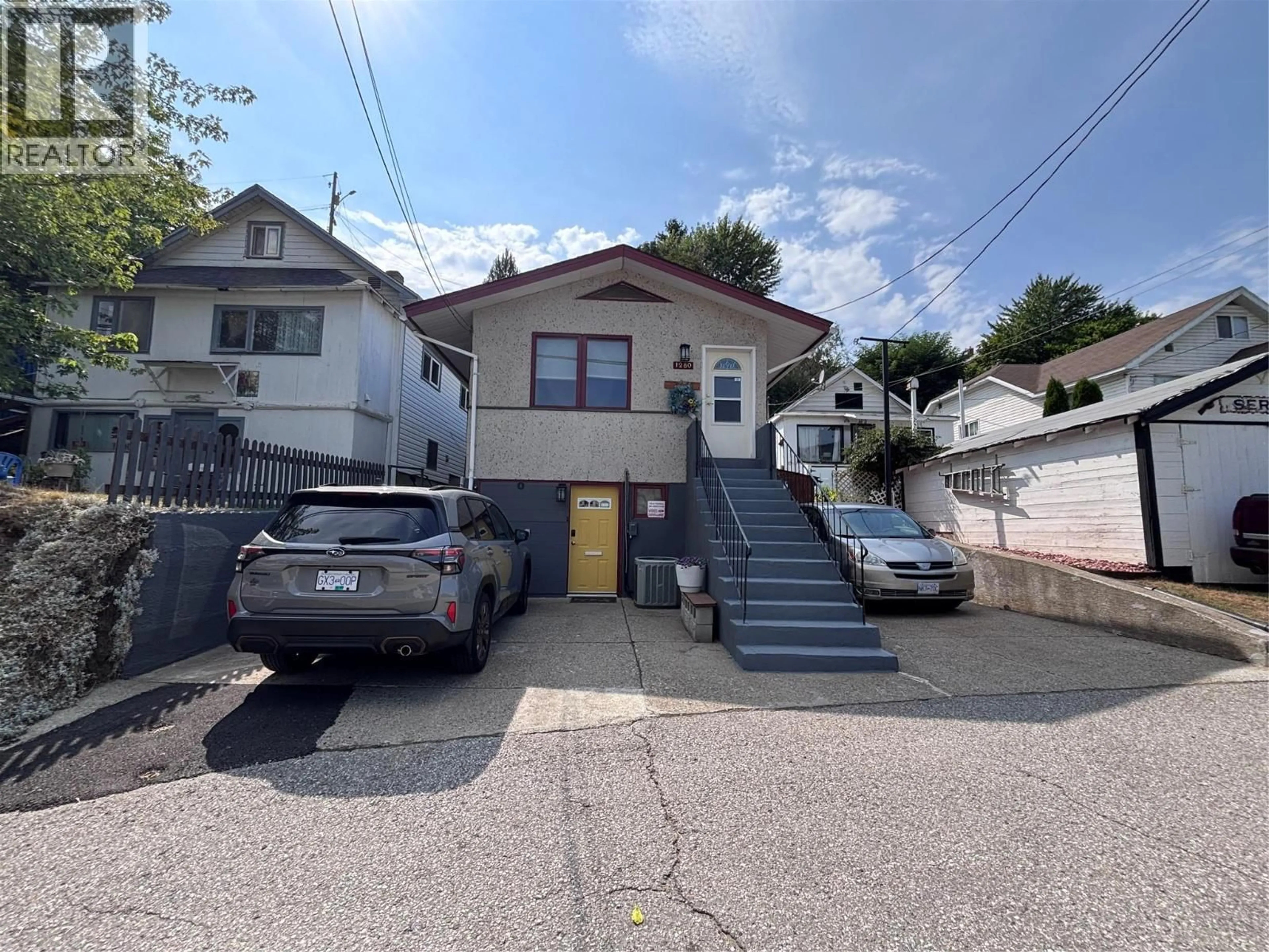 A pic from outside/outdoor area/front of a property/back of a property/a pic from drone, street for 1280 GREEN AVENUE, Trail British Columbia V1R4K1