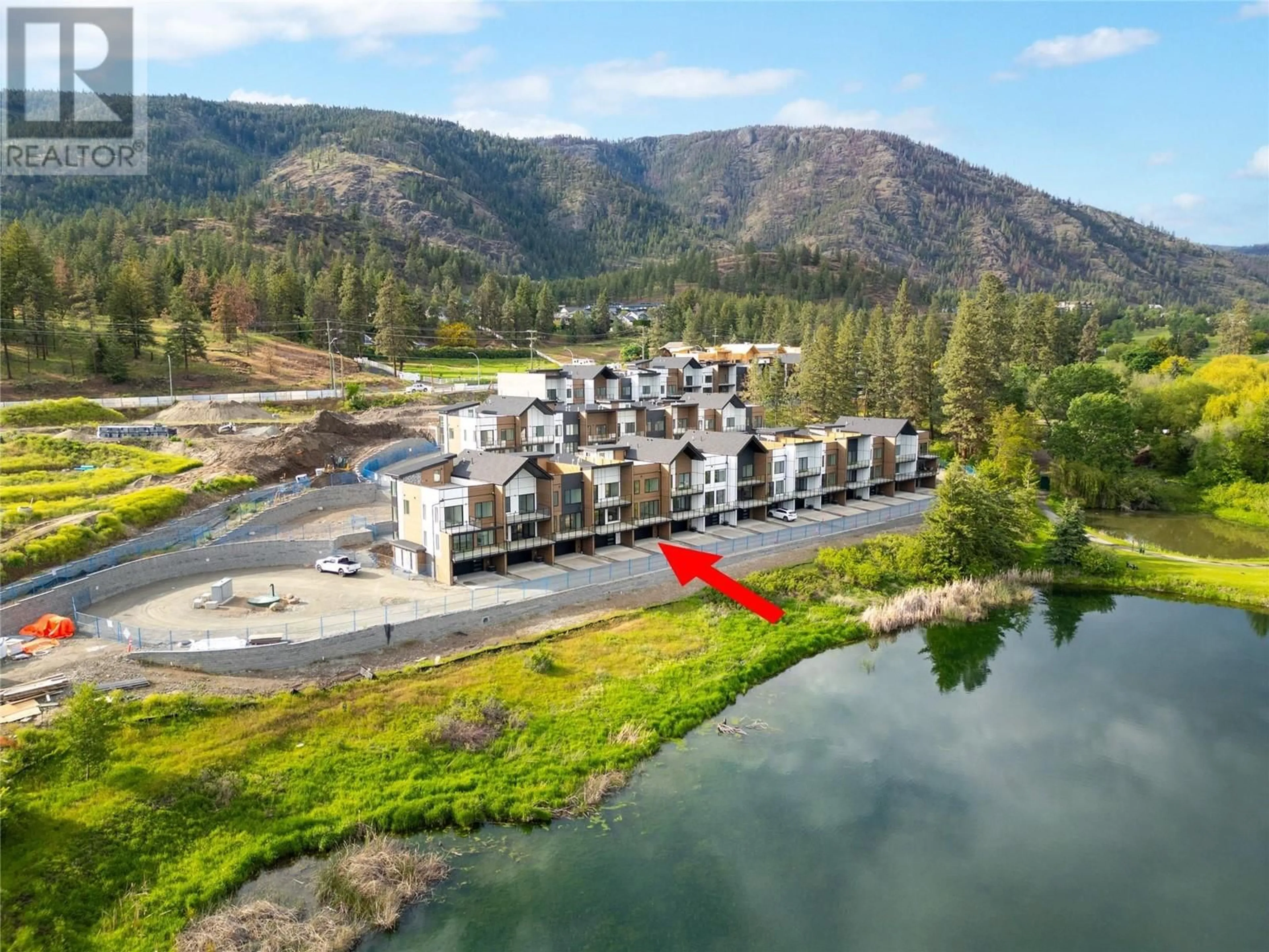 A pic from outside/outdoor area/front of a property/back of a property/a pic from drone, water/lake/river/ocean view for 105 - 2735 SHANNON LAKE ROAD, West Kelowna British Columbia V4T1V6