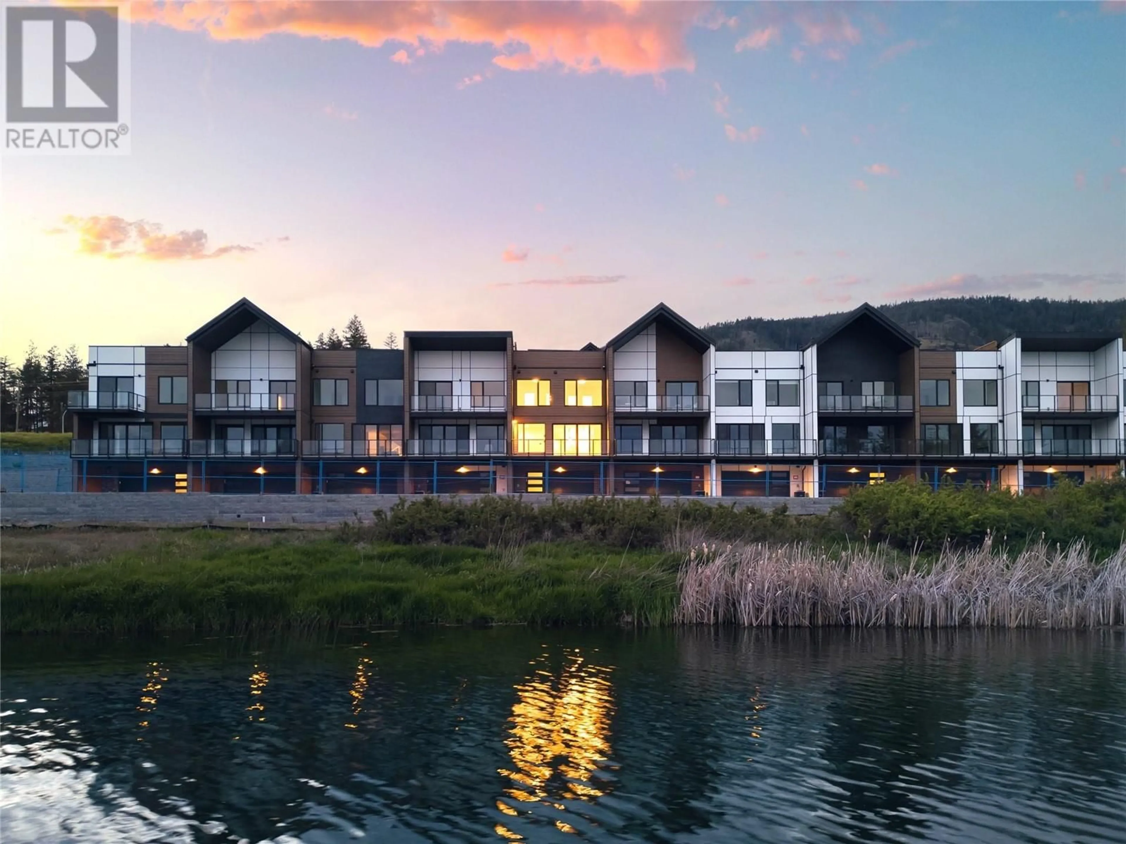 A pic from outside/outdoor area/front of a property/back of a property/a pic from drone, water/lake/river/ocean view for 105 - 2735 SHANNON LAKE ROAD, West Kelowna British Columbia V4T1V6