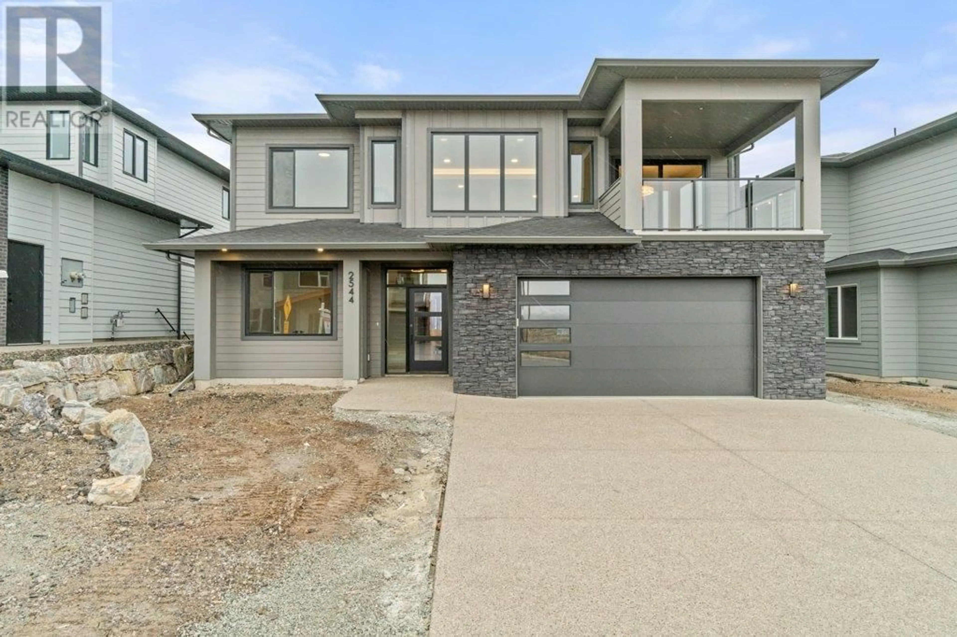 Home with brick exterior material, street for 2544 Pinnacle Ridge Drive, West Kelowna British Columbia V4T0E3