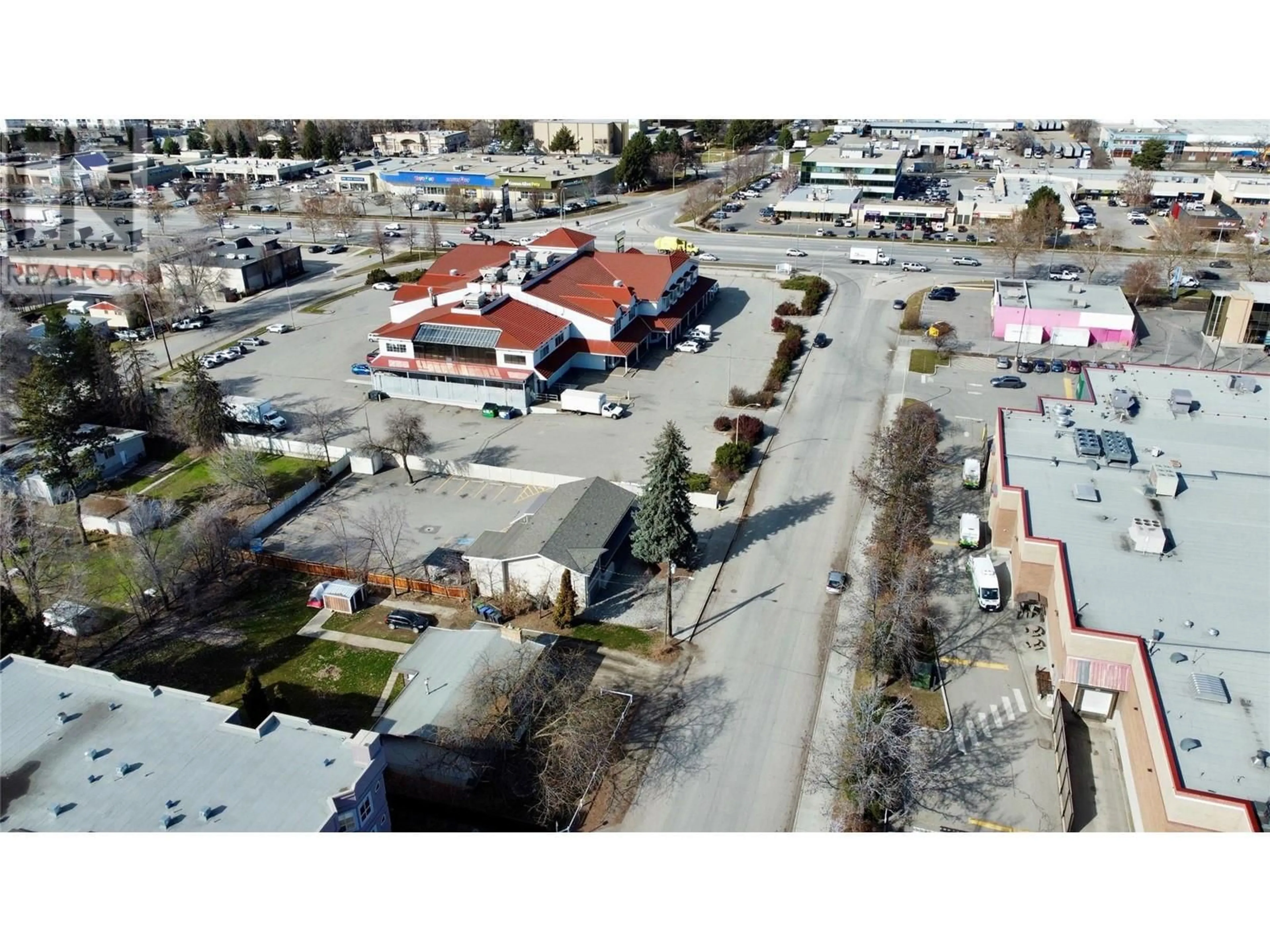 A pic from outside/outdoor area/front of a property/back of a property/a pic from drone, street for 2110 Vasile Road, Kelowna British Columbia V1Y6H5