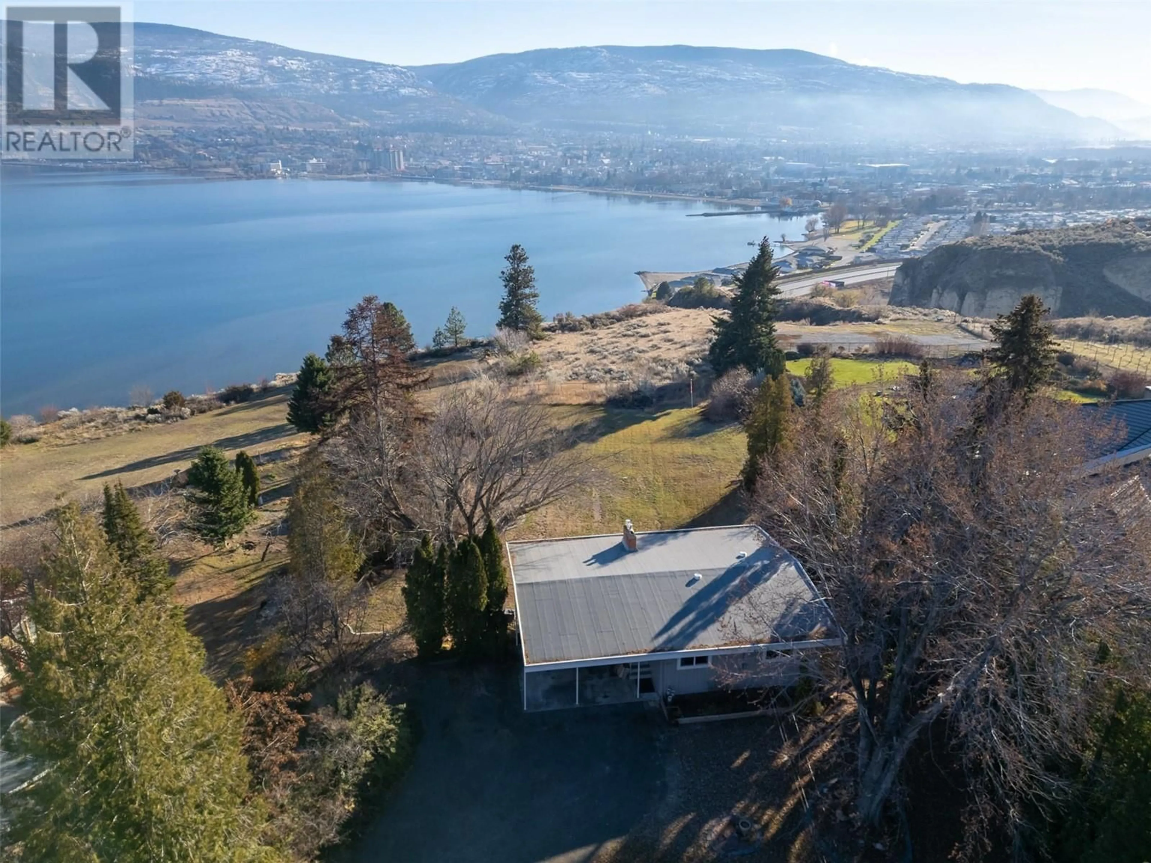 A pic from outside/outdoor area/front of a property/back of a property/a pic from drone, water/lake/river/ocean view for 117 HYSLOP DRIVE, Penticton British Columbia V2A9A1