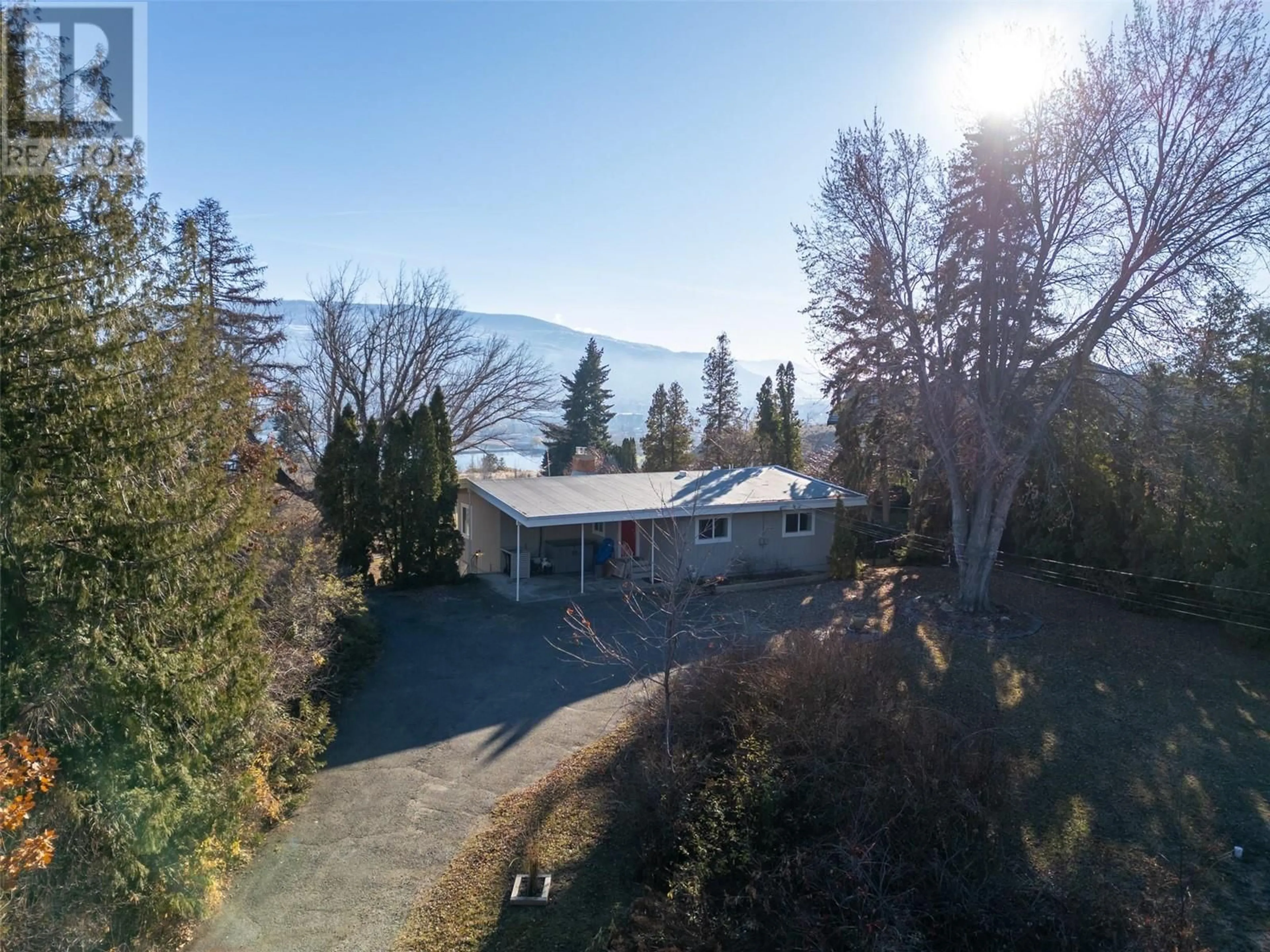 A pic from outside/outdoor area/front of a property/back of a property/a pic from drone, mountain view for 117 Hyslop Drive, Penticton British Columbia V2A9A1