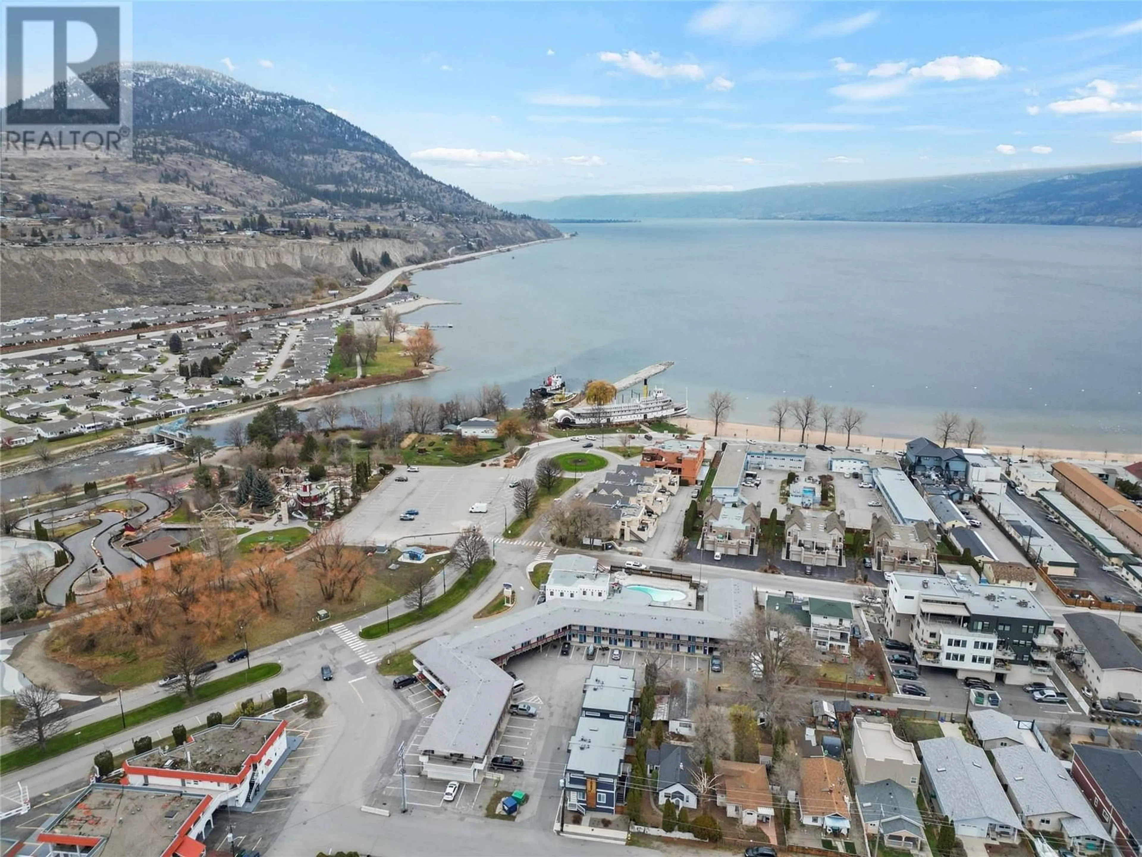 A pic from outside/outdoor area/front of a property/back of a property/a pic from drone, water/lake/river/ocean view for 1087 Dynes Avenue Unit# 102, Penticton British Columbia V2A1E9