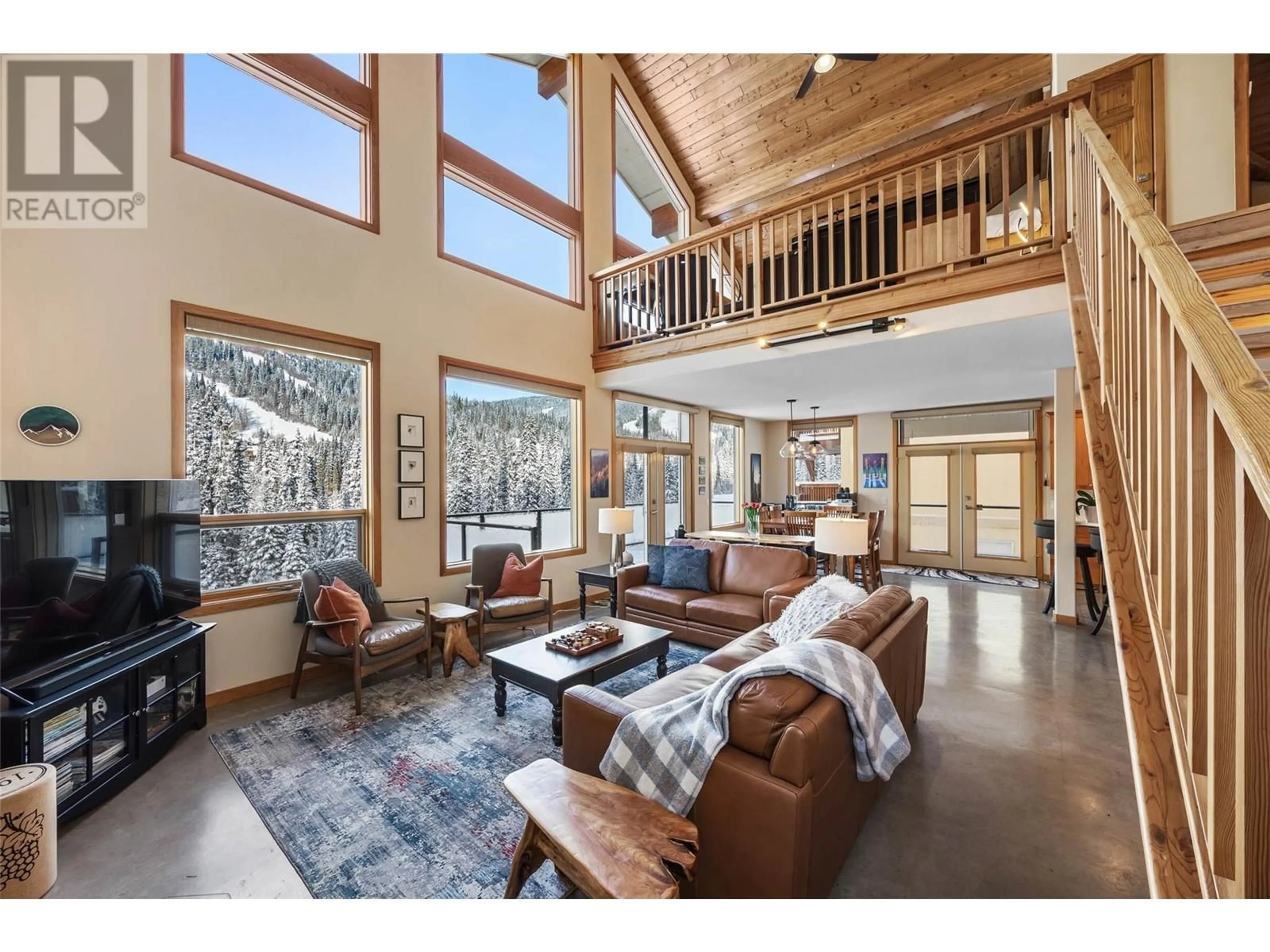 Living room with furniture, wood/laminate floor for 2416 Fairways Drive, Sun Peaks British Columbia V0E5N0