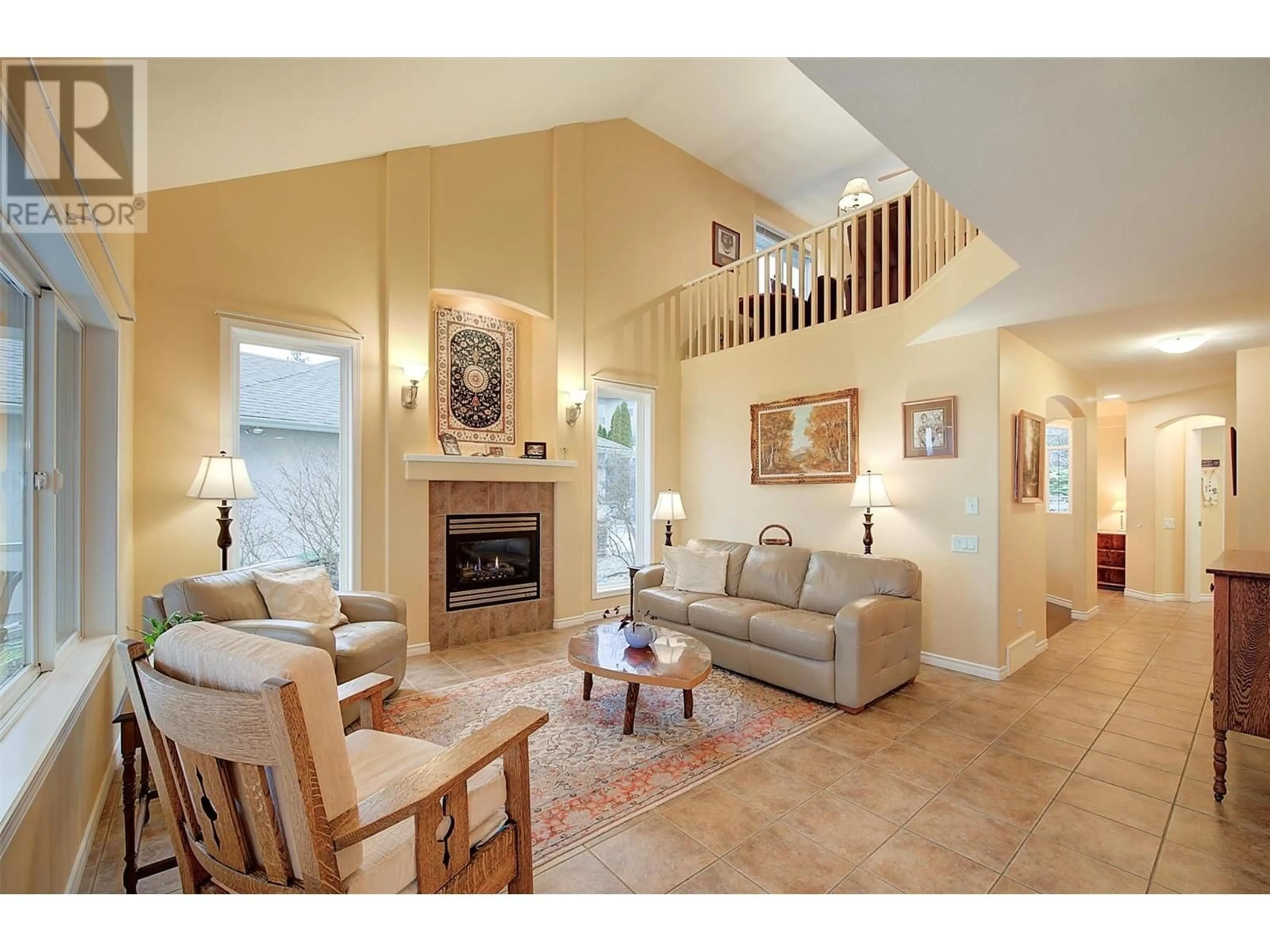 Living room with furniture, ceramic/tile floor for 620 Arrowleaf Lane, Kelowna British Columbia V1W4Y5