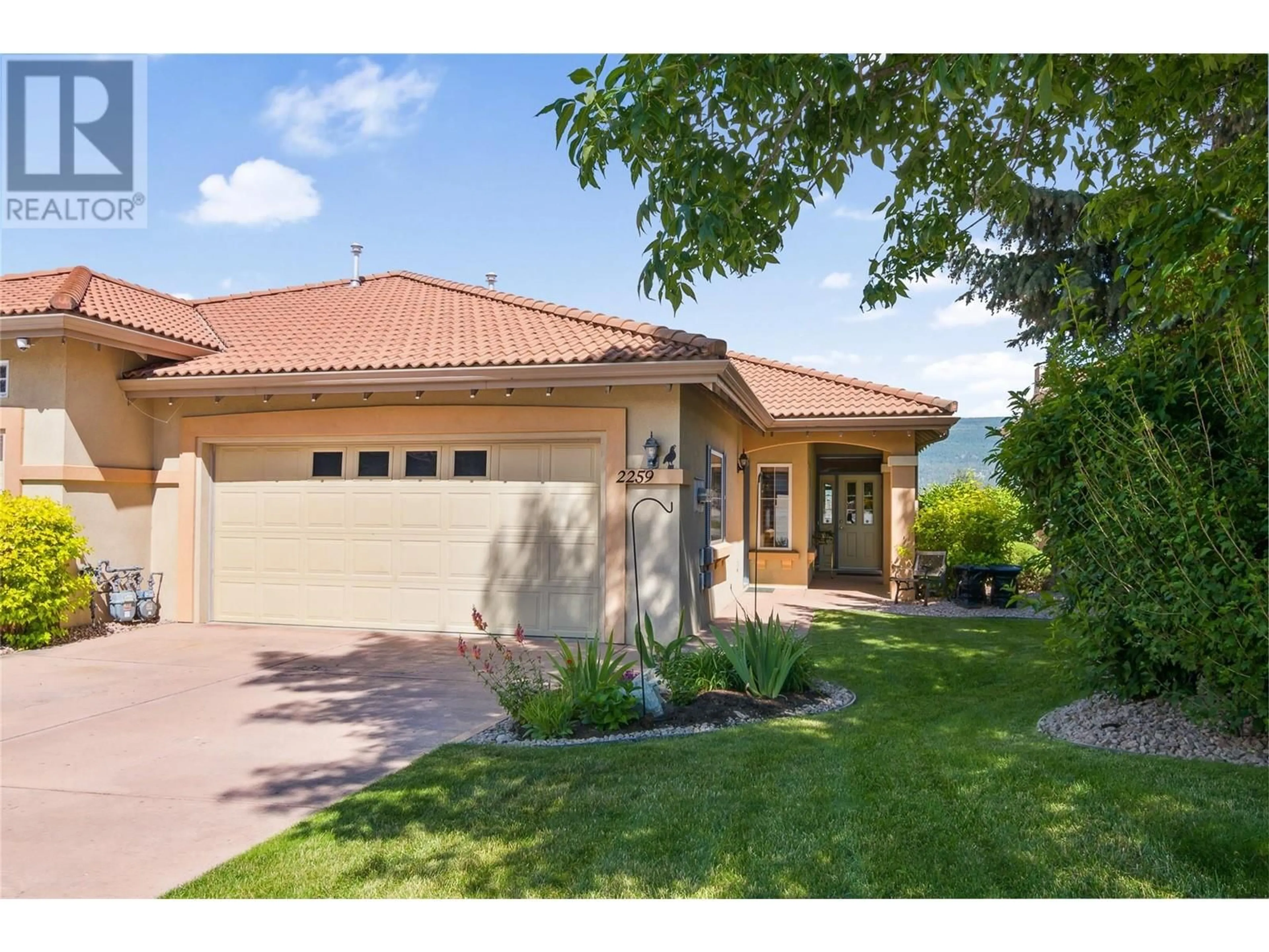Home with brick exterior material, street for 2259 CAPISTRANO DRIVE, Kelowna British Columbia V1V2M9