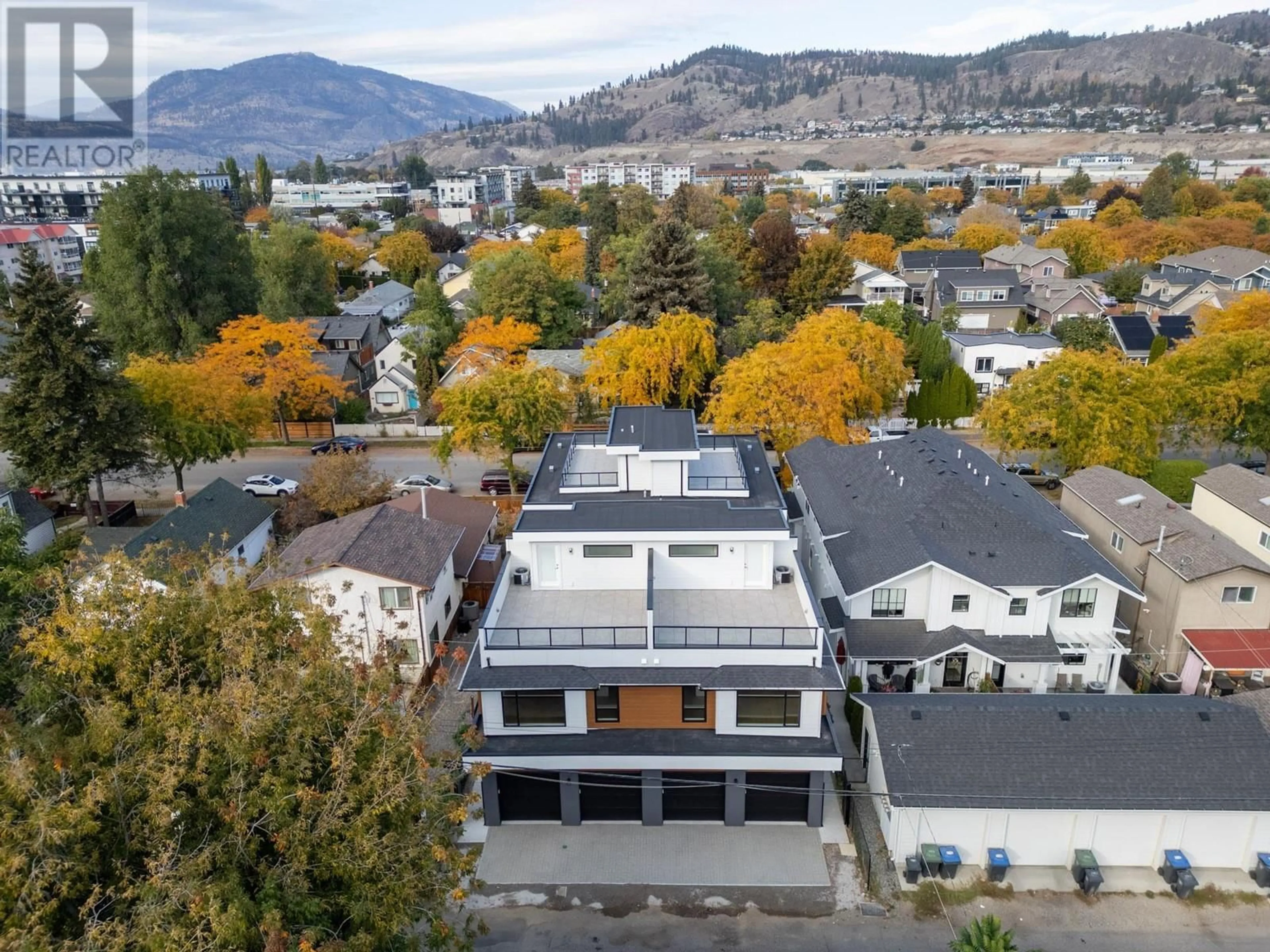 A pic from outside/outdoor area/front of a property/back of a property/a pic from drone, mountain view for 751 Fuller Avenue Unit# 1, Kelowna British Columbia V1Y6X2