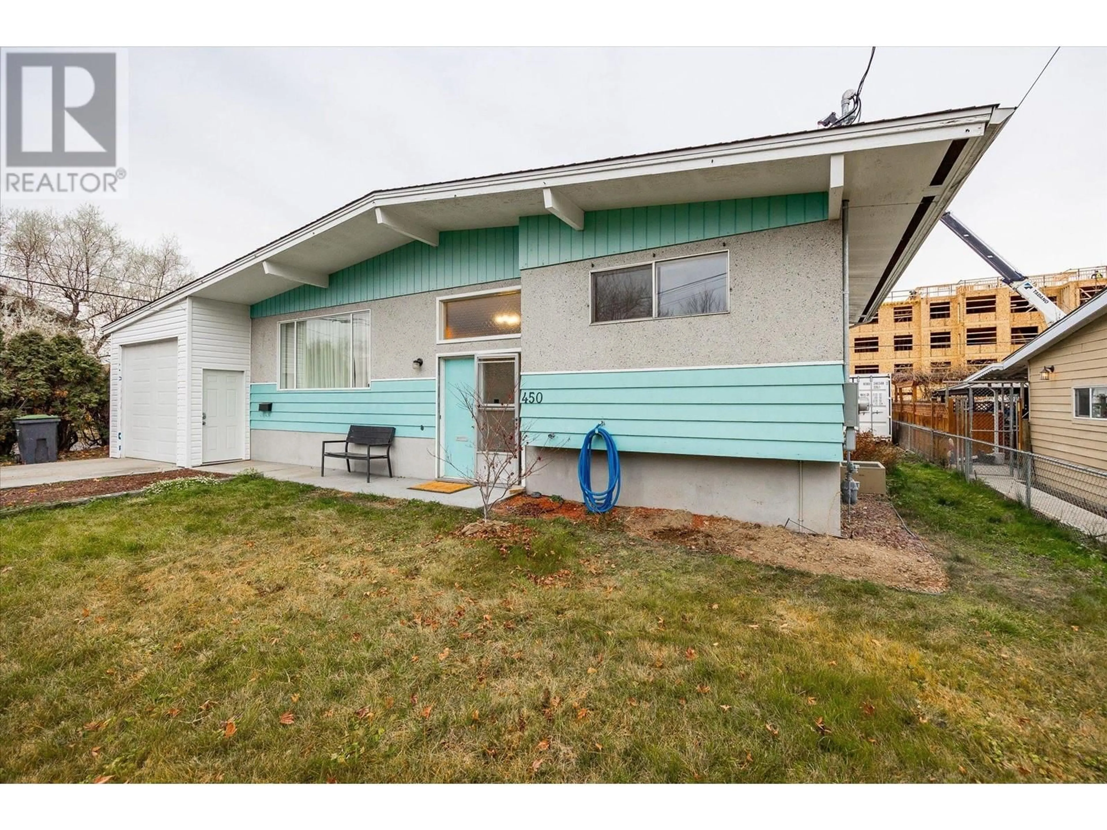 Home with vinyl exterior material, street for 450 MCDONALD ROAD, Kelowna British Columbia V1X3H2