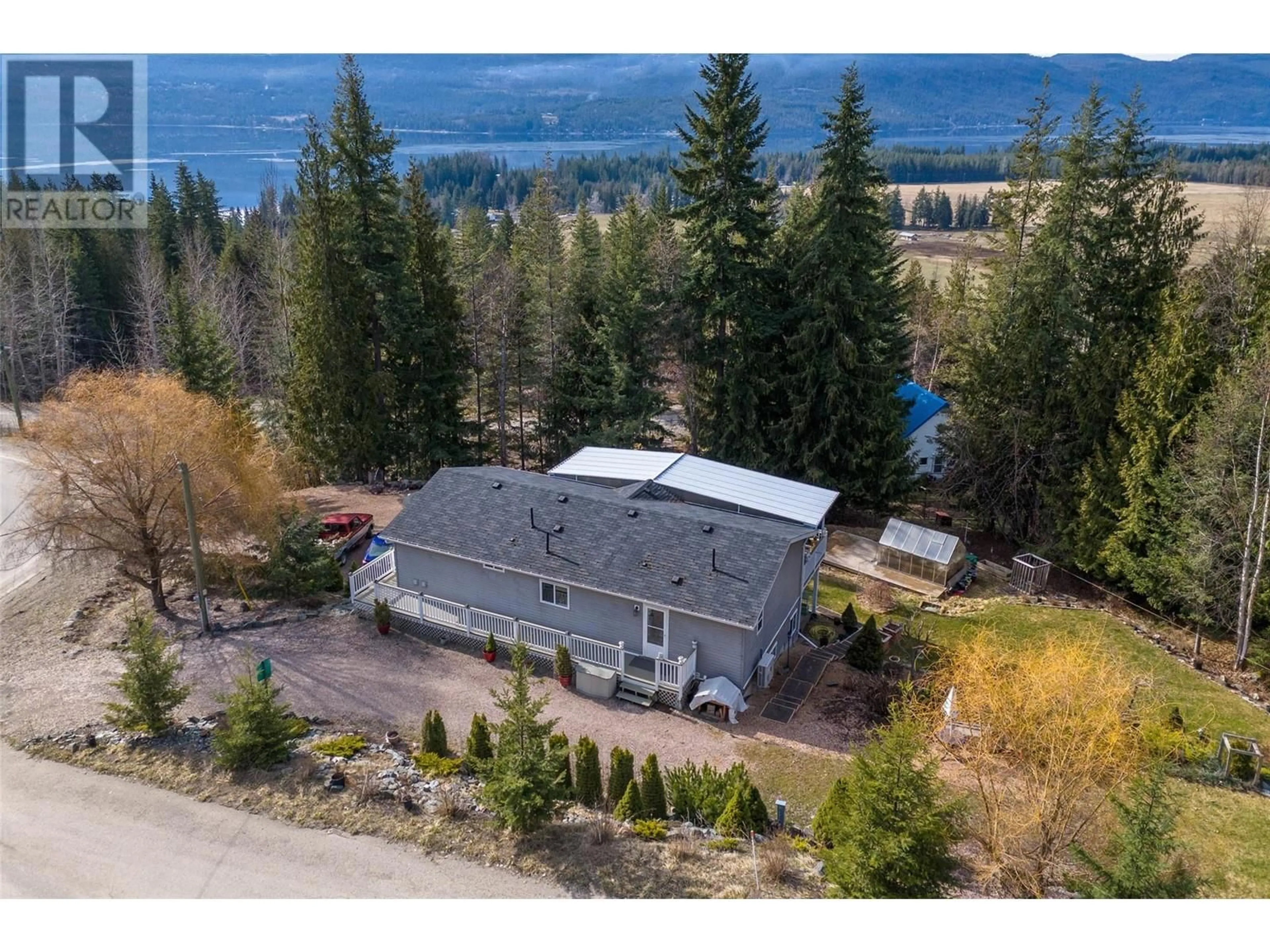 A pic from outside/outdoor area/front of a property/back of a property/a pic from drone, water/lake/river/ocean view for 2715 Fraser Road, Anglemont British Columbia V0E1M8