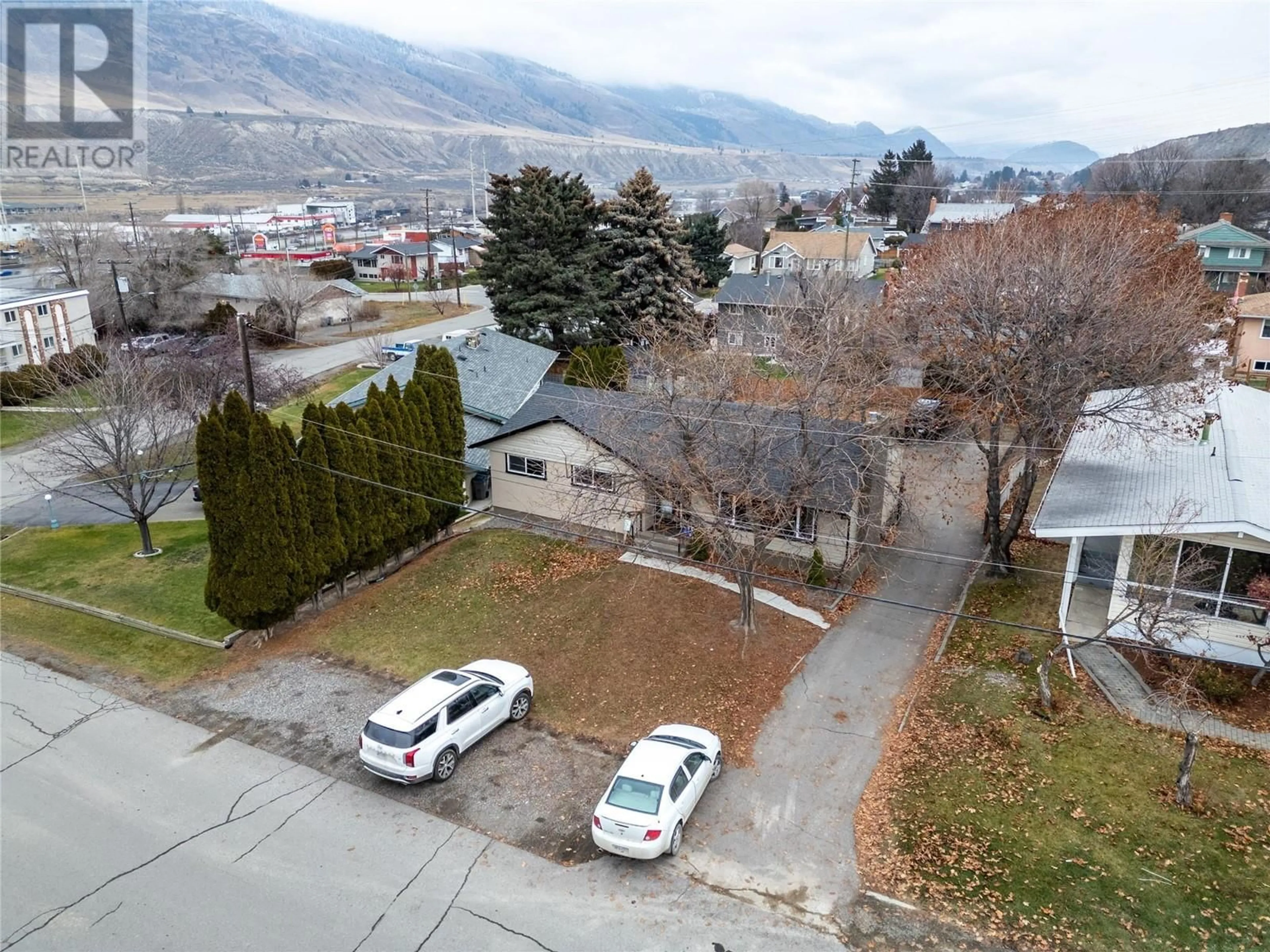 A pic from outside/outdoor area/front of a property/back of a property/a pic from drone, mountain view for 173 KNOLLWOOD Drive, Kamloops British Columbia V2C4M5