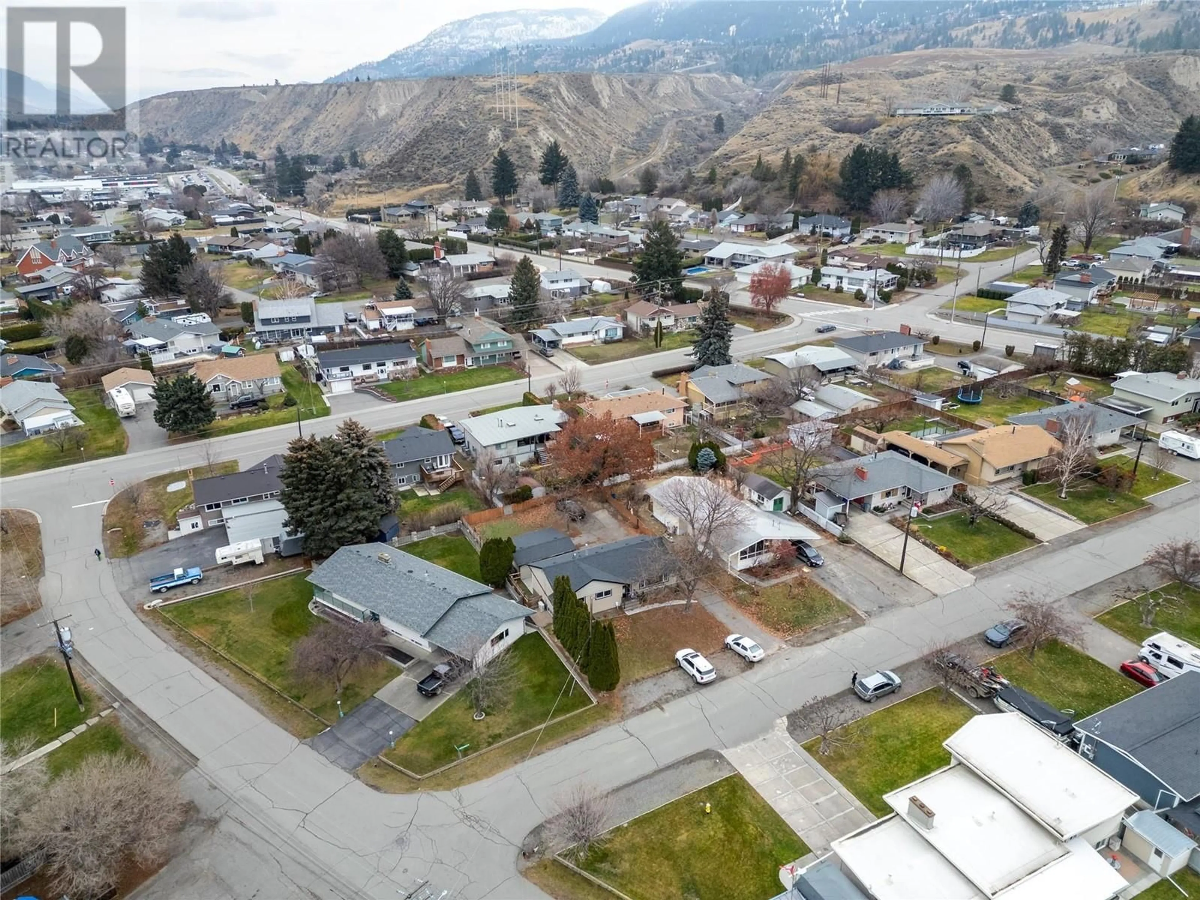 A pic from outside/outdoor area/front of a property/back of a property/a pic from drone, mountain view for 173 KNOLLWOOD Drive, Kamloops British Columbia V2C4M5