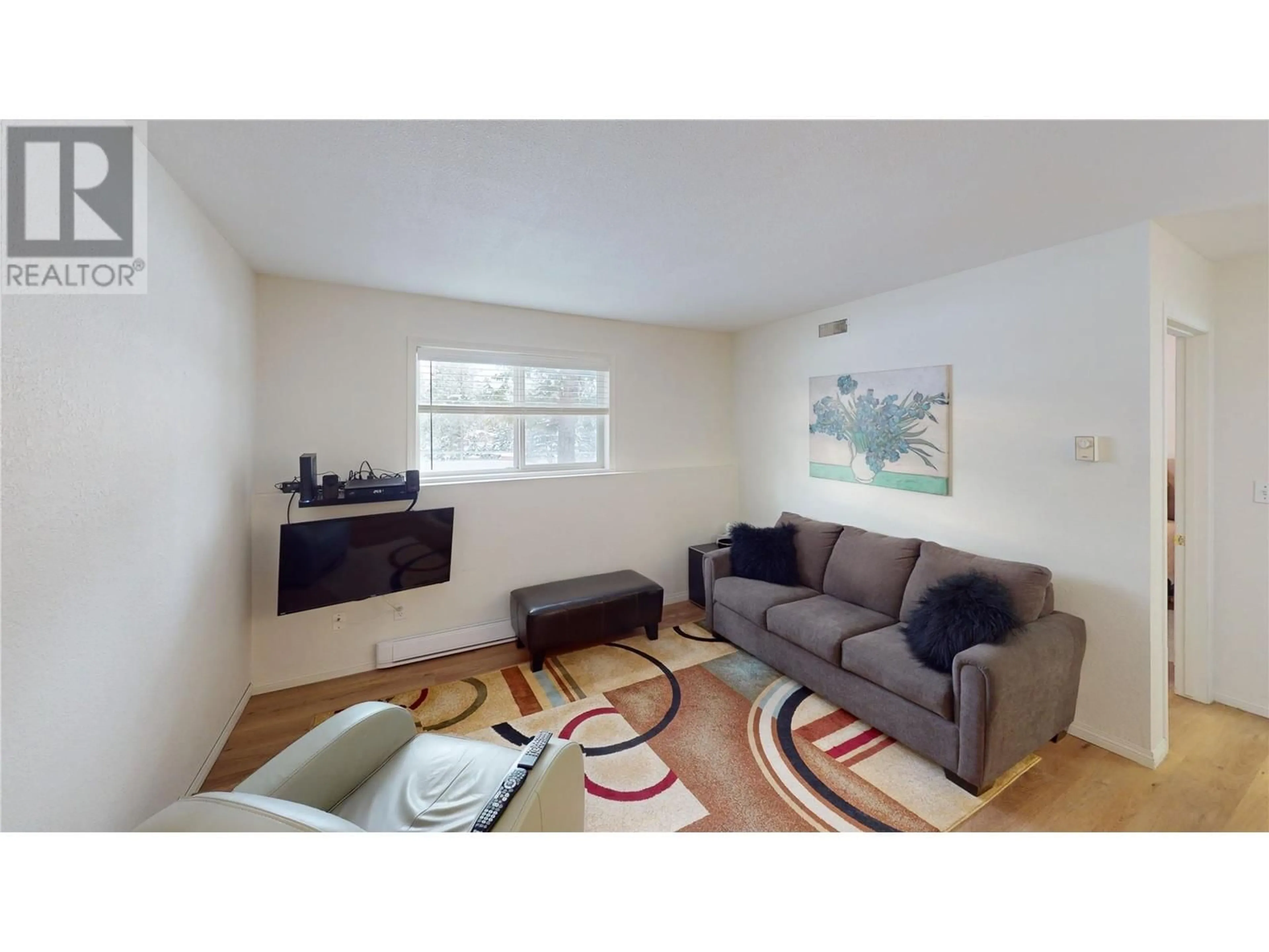 Living room with furniture, wood/laminate floor for 7369 Prospector Avenue Unit# 3, Radium Hot Springs British Columbia V0A1M0