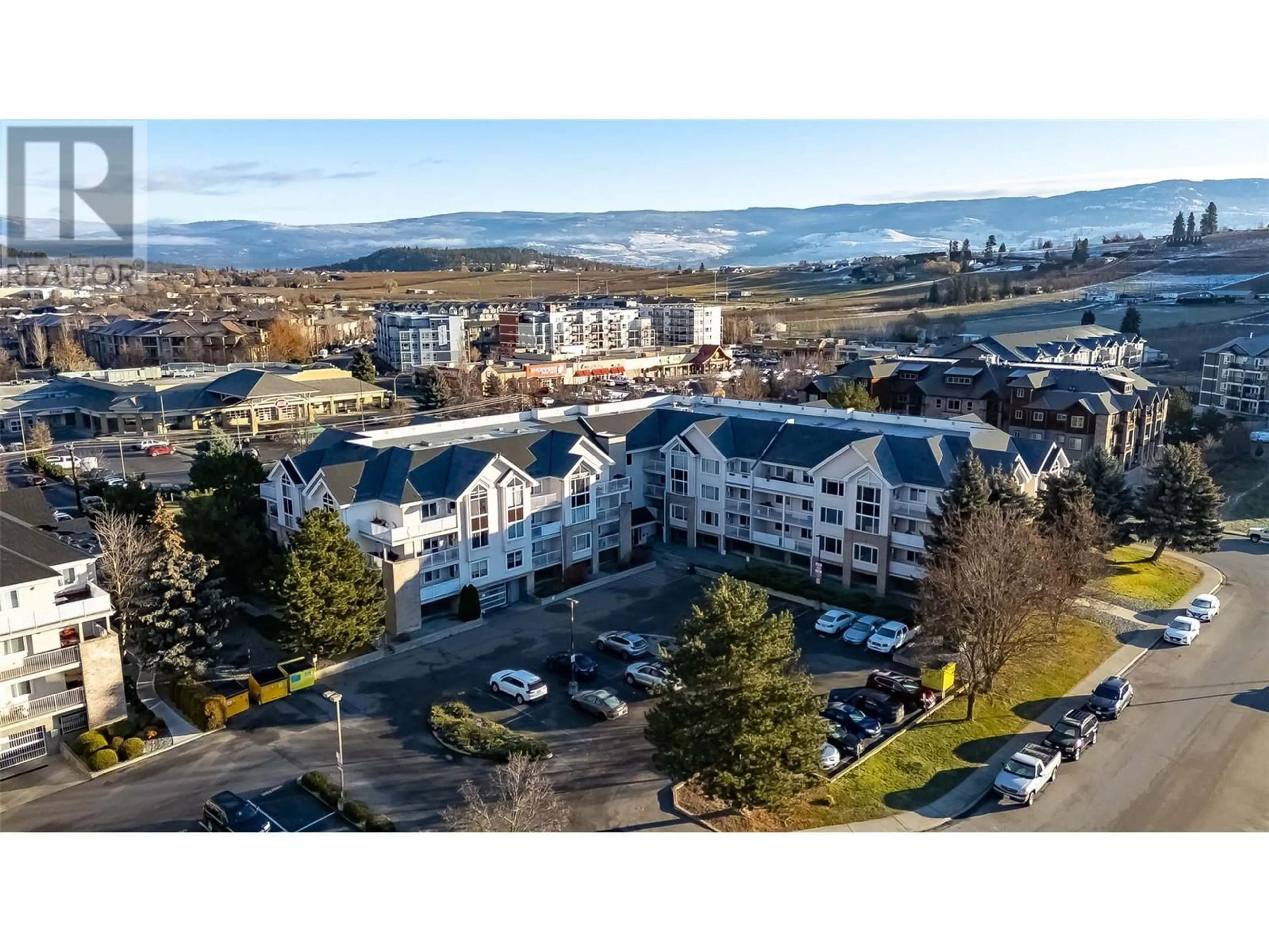 A pic from outside/outdoor area/front of a property/back of a property/a pic from drone, mountain view for 400 Sutton Crescent Unit# 215, Kelowna British Columbia V1V1Y3