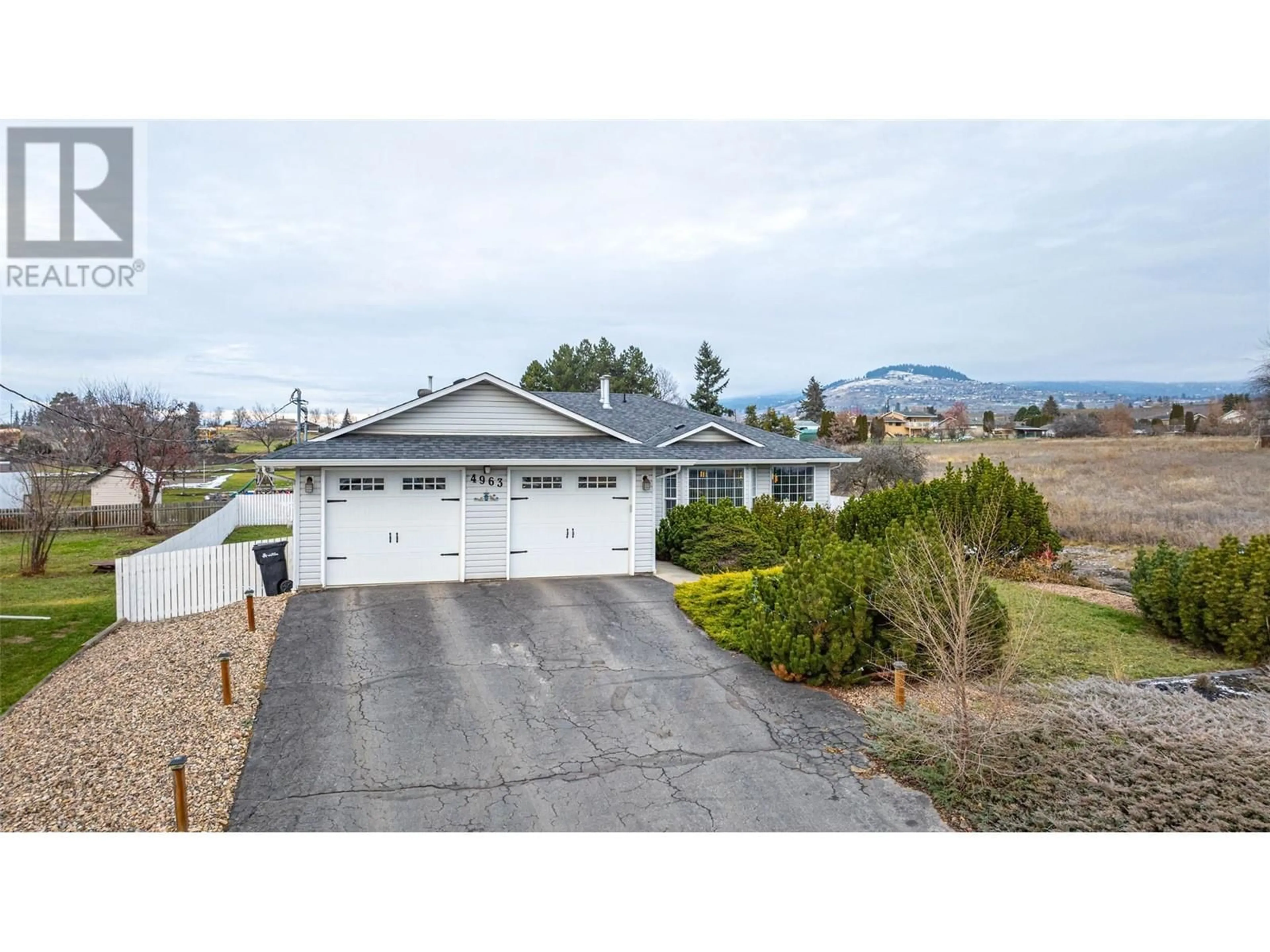 A pic from outside/outdoor area/front of a property/back of a property/a pic from drone, unknown for 4963 Silver Star Road, Vernon British Columbia V1B3K3